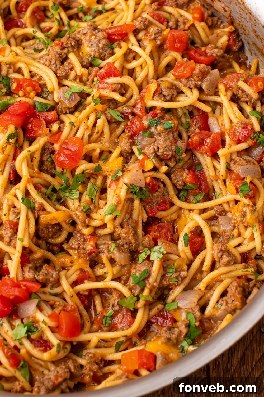 One Pot Cheesy Taco Spaghetti 20 Taco spaghetti with Rotel in a metal pan on table