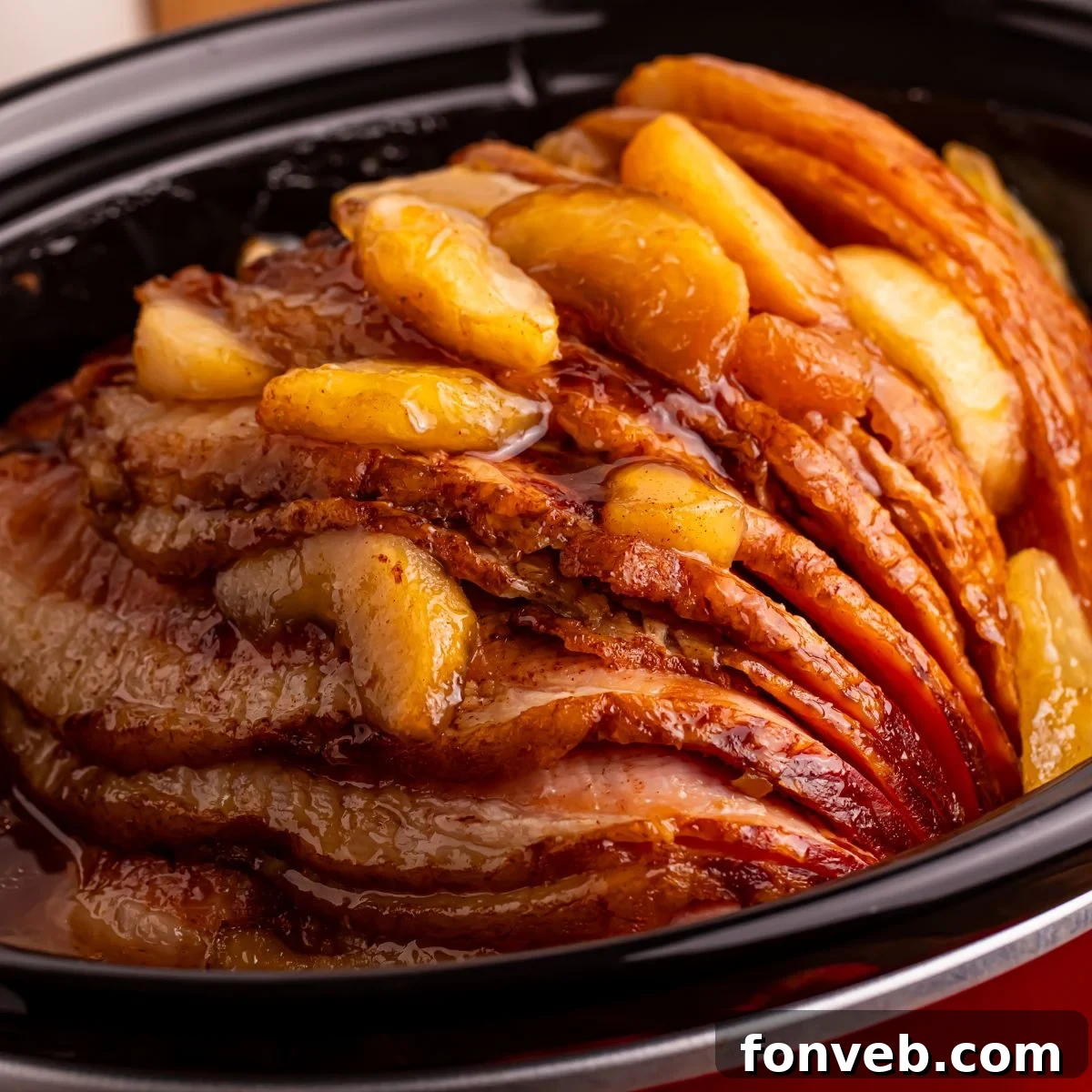 Tender and Juicy Slow Cooker Apple Glazed Ham 2 Slow Cooker Apple Glazed Ham in a red crockpot sitting on table
