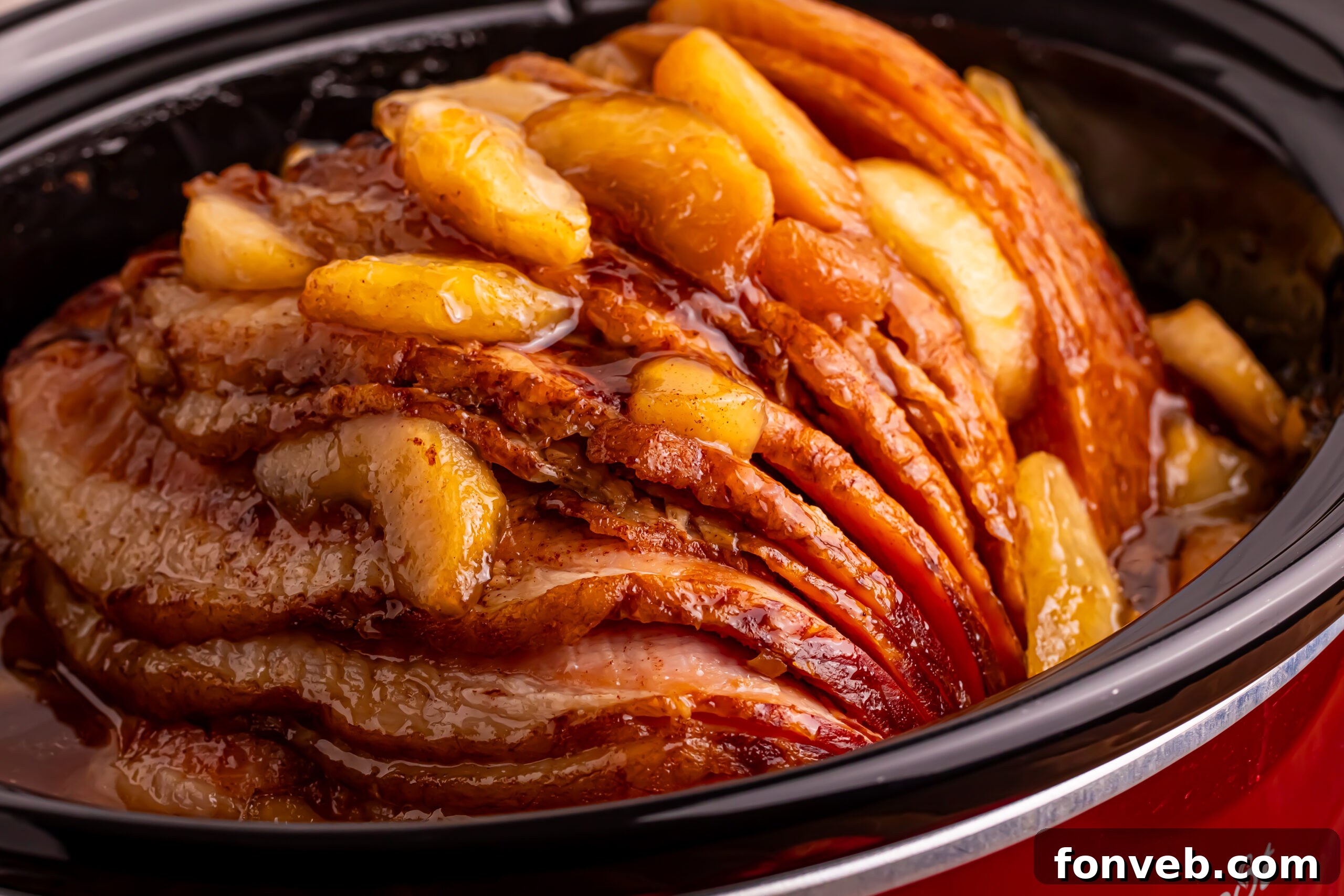 Tender and Juicy Slow Cooker Apple Glazed Ham 11 Side view of the Slow Cooker Apple Glazed Ham in a red slow cooker