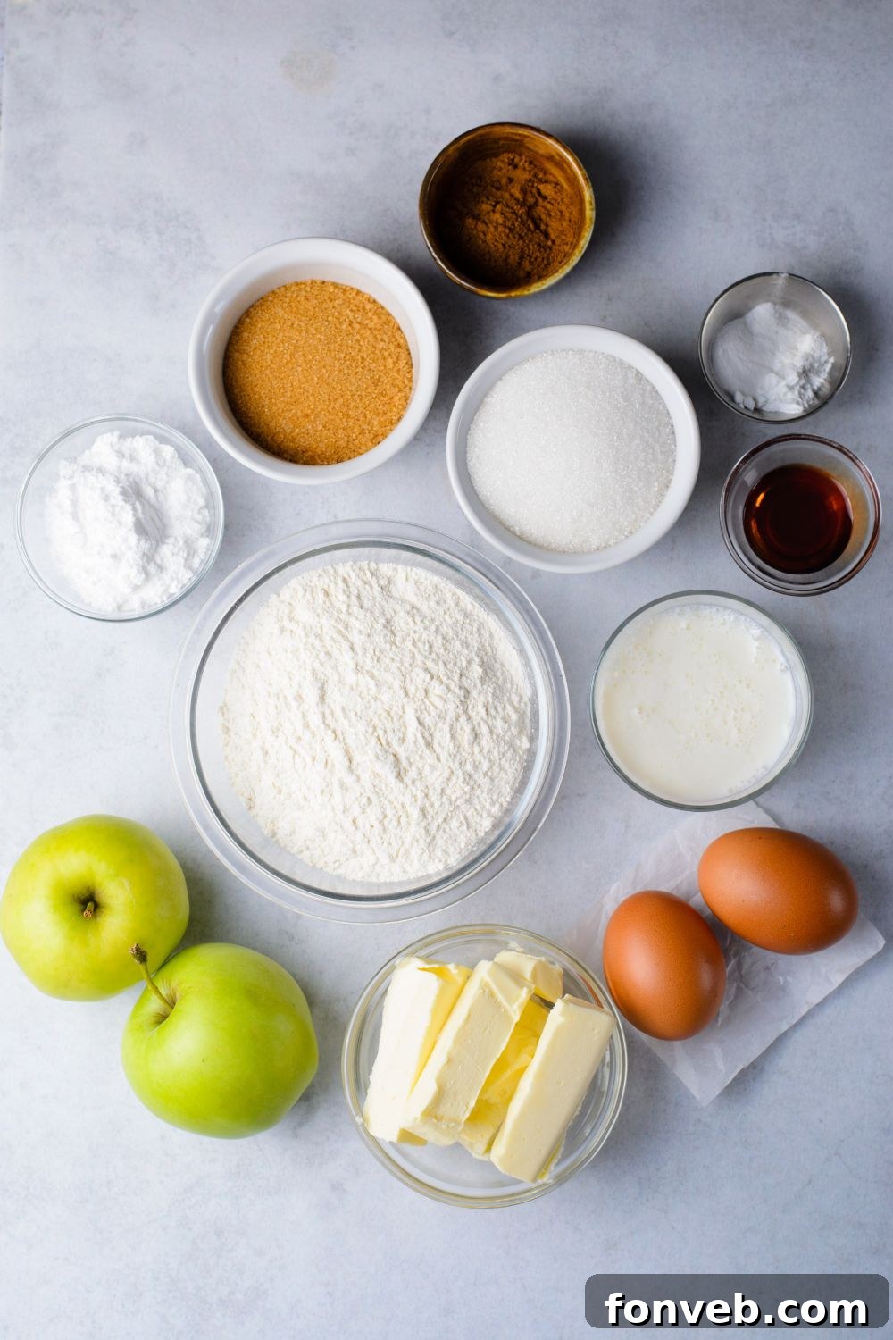 ingredients in single serve containers to make Amish Apple Fritter Bread on a marble counter 