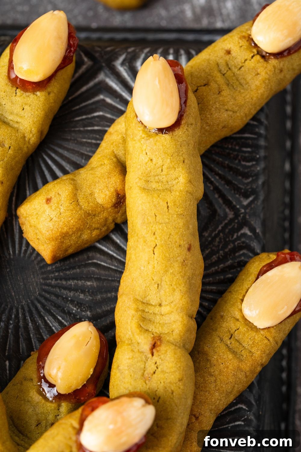 Witch Finger Cookies A Ghoulishly Fun Halloween Bake 15 Witch Finger Cookies on a black tray with a close up of fingers
