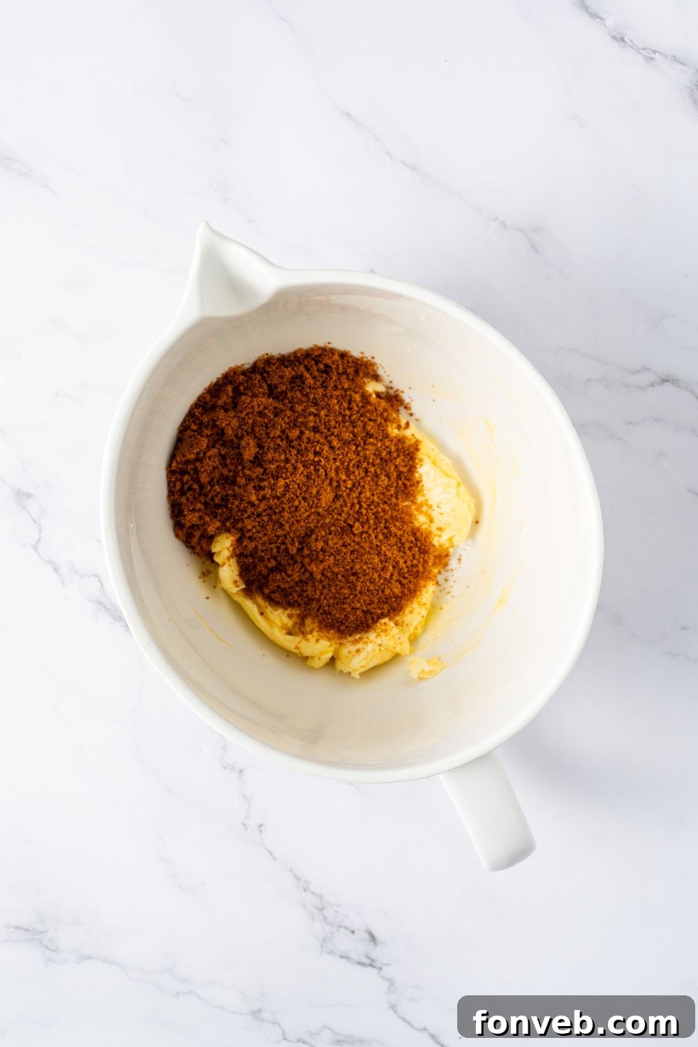 Witch Finger Cookies A Ghoulishly Fun Halloween Bake 7 wet and dry ingredients for making Witch Finger Cookies in a white bowl on table