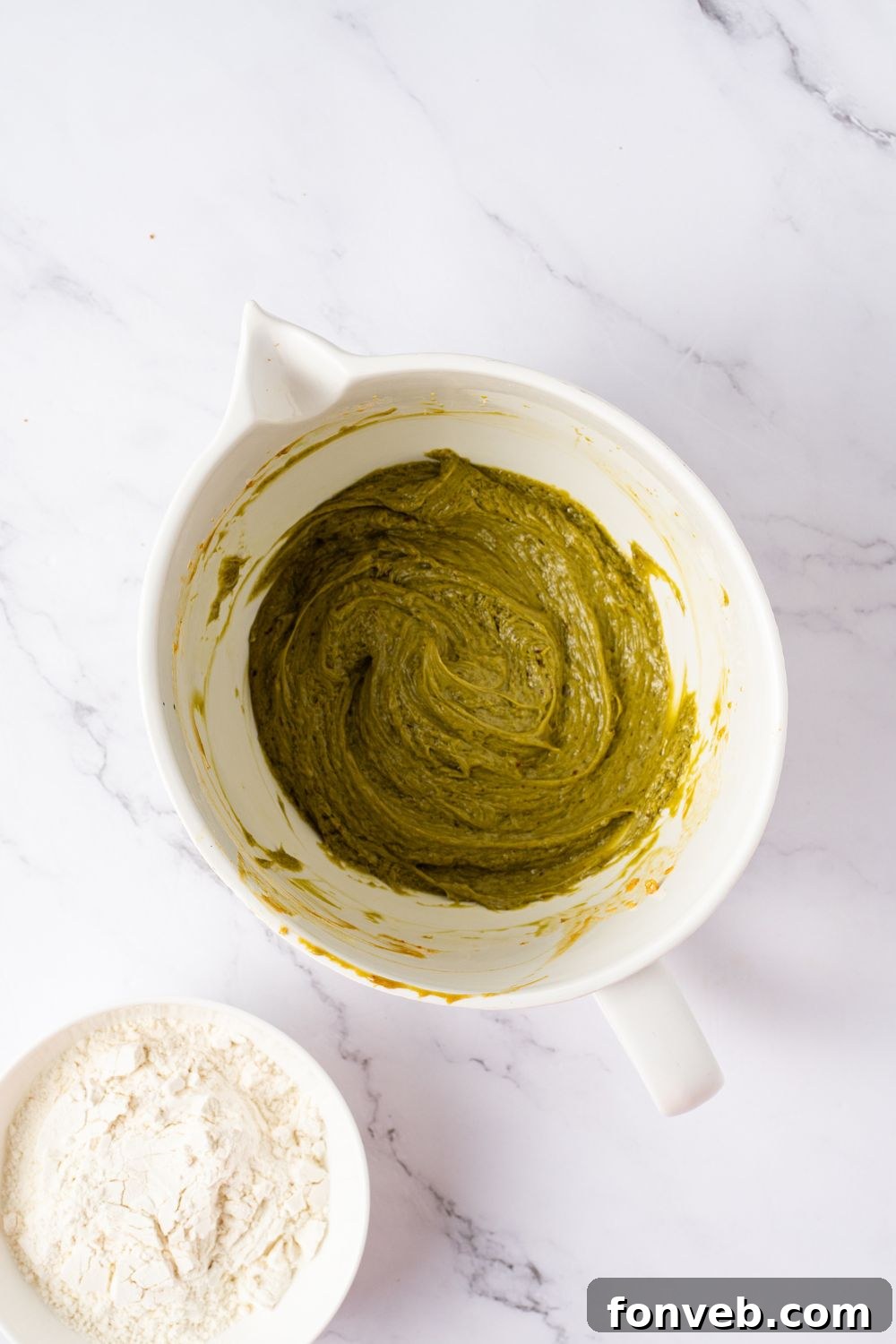 Witch Finger Cookies A Ghoulishly Fun Halloween Bake 8 green pistachio cookie dough in a white bowl on table with pistachio butter and vanilla to side