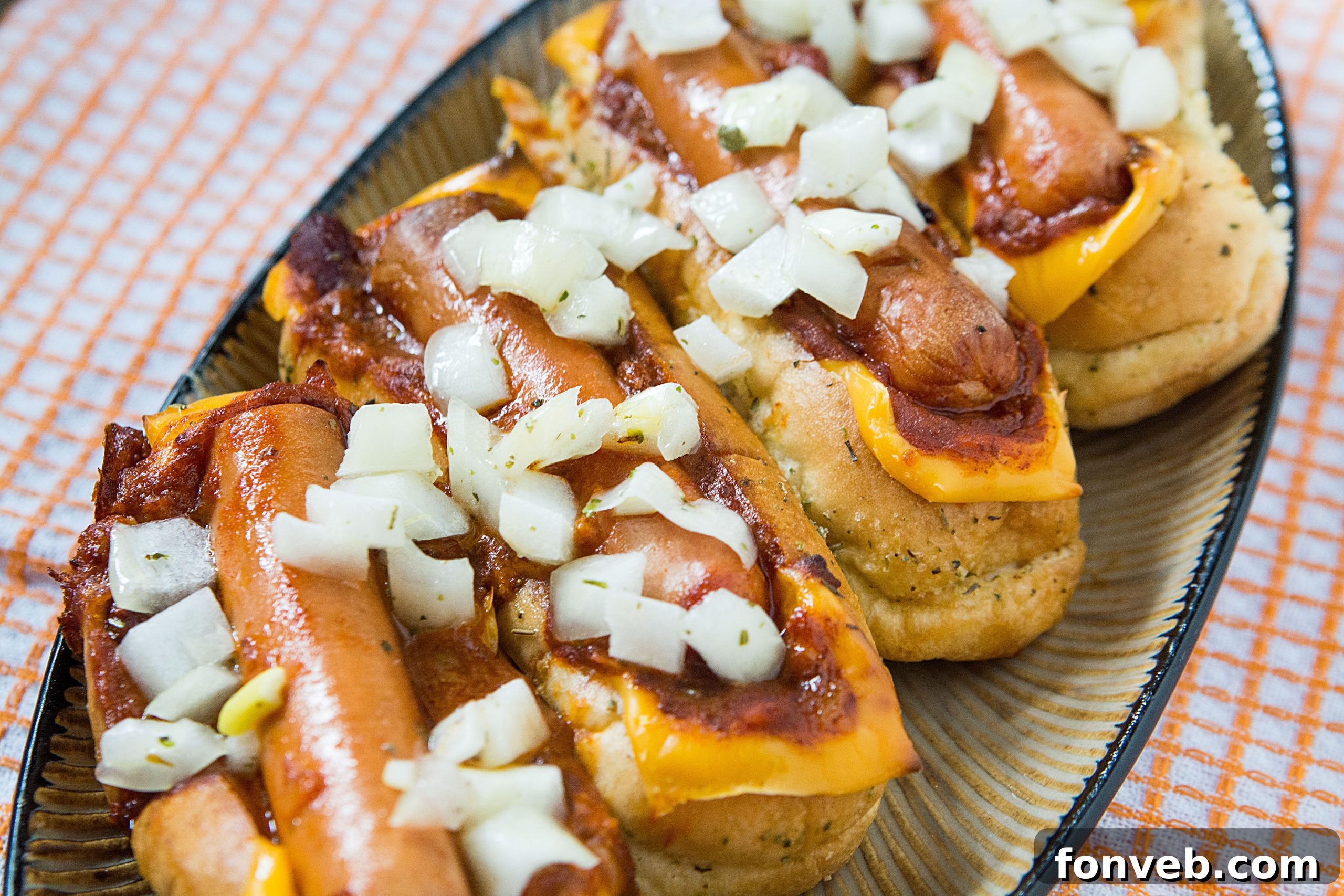 The finished Chili Cheese Dog Boats, golden brown and bubbling with melted cheese and chili, fresh out of the oven.