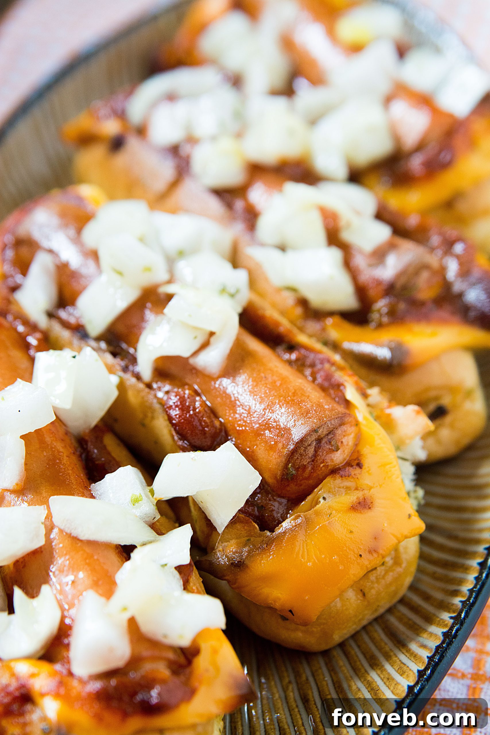 Another appealing shot of two chili cheese dog boats, highlighting their delicious and hearty appearance, ready to be enjoyed.