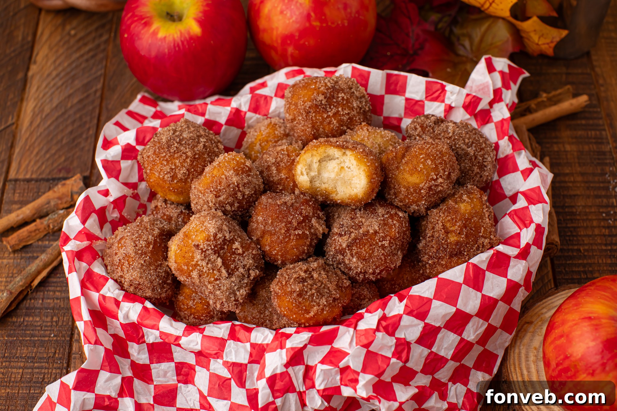 basket full of Apple Pie Donut Holes  in a checked serving basket 