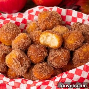 Apple Pie Donut Holes in a basket with a checked parchment paper in basket