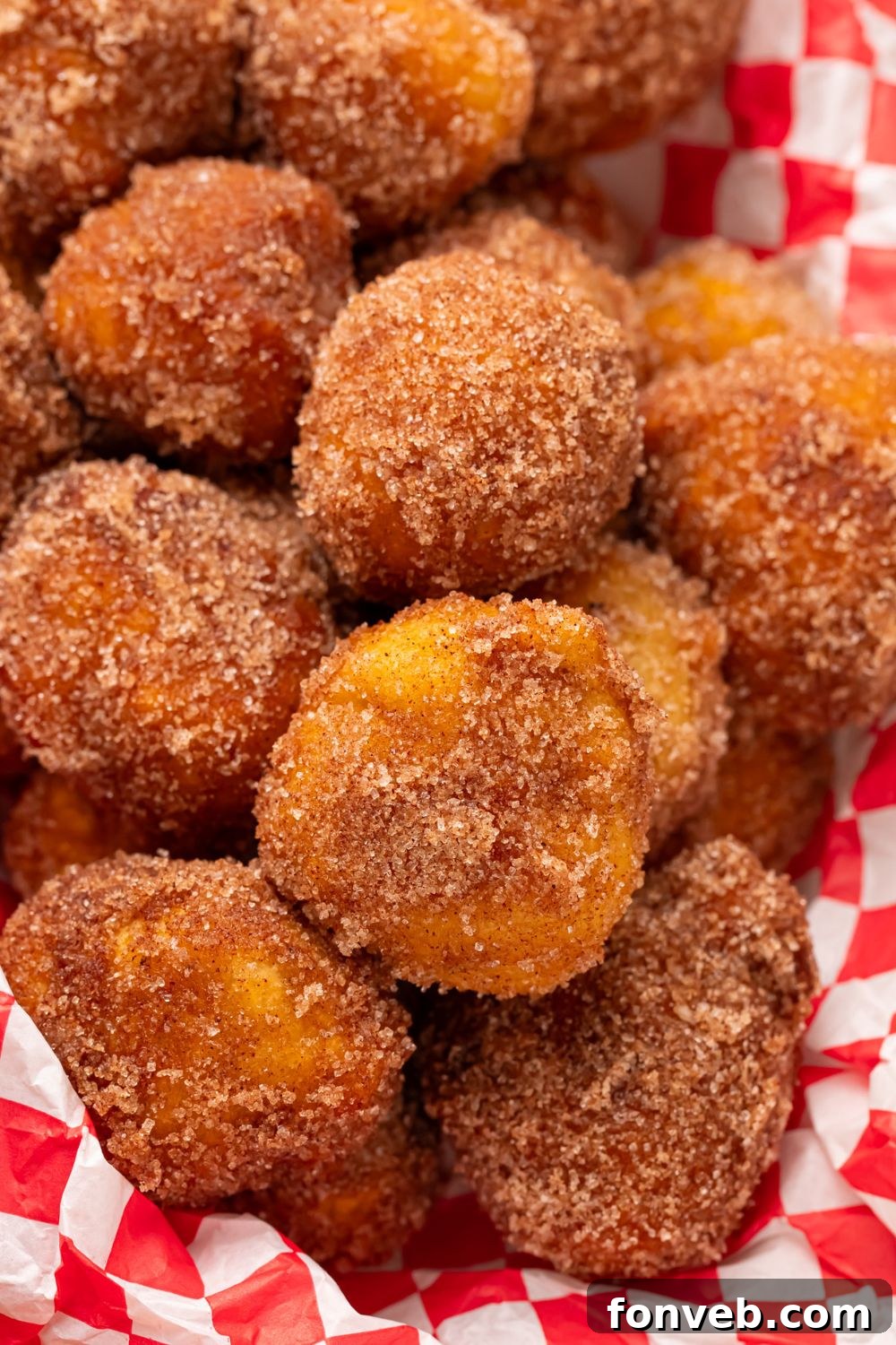 basket with Apple Pie Donut Holes in it coated in cinnamon and sugar 