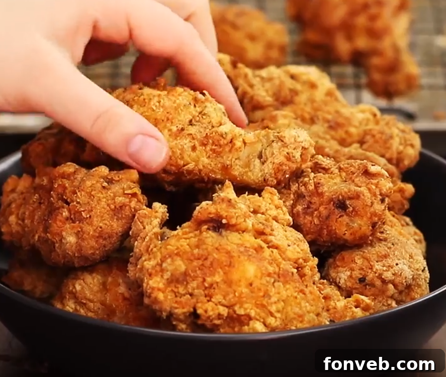 Six pieces of crispy Popeyes style fried chicken in a basket