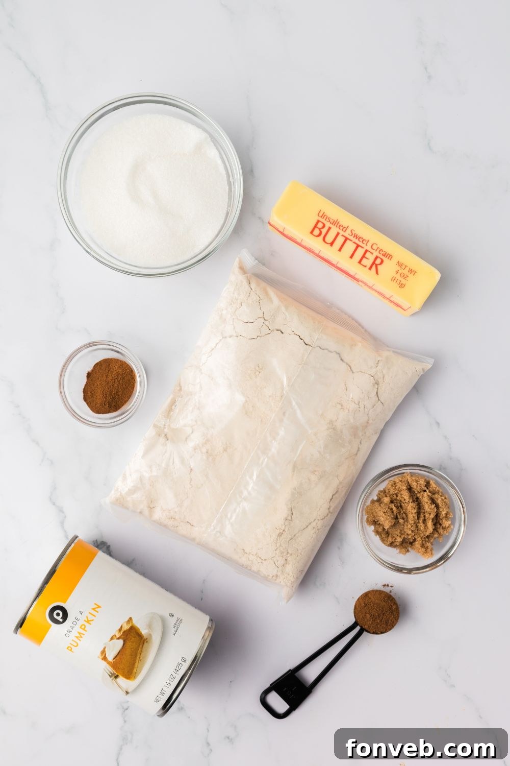 Cinnamon Sugar Baked Pumpkin Spice Donut Holes 4 ingredients for making Baked pumpkin donut holes spread out on table in single serve containers