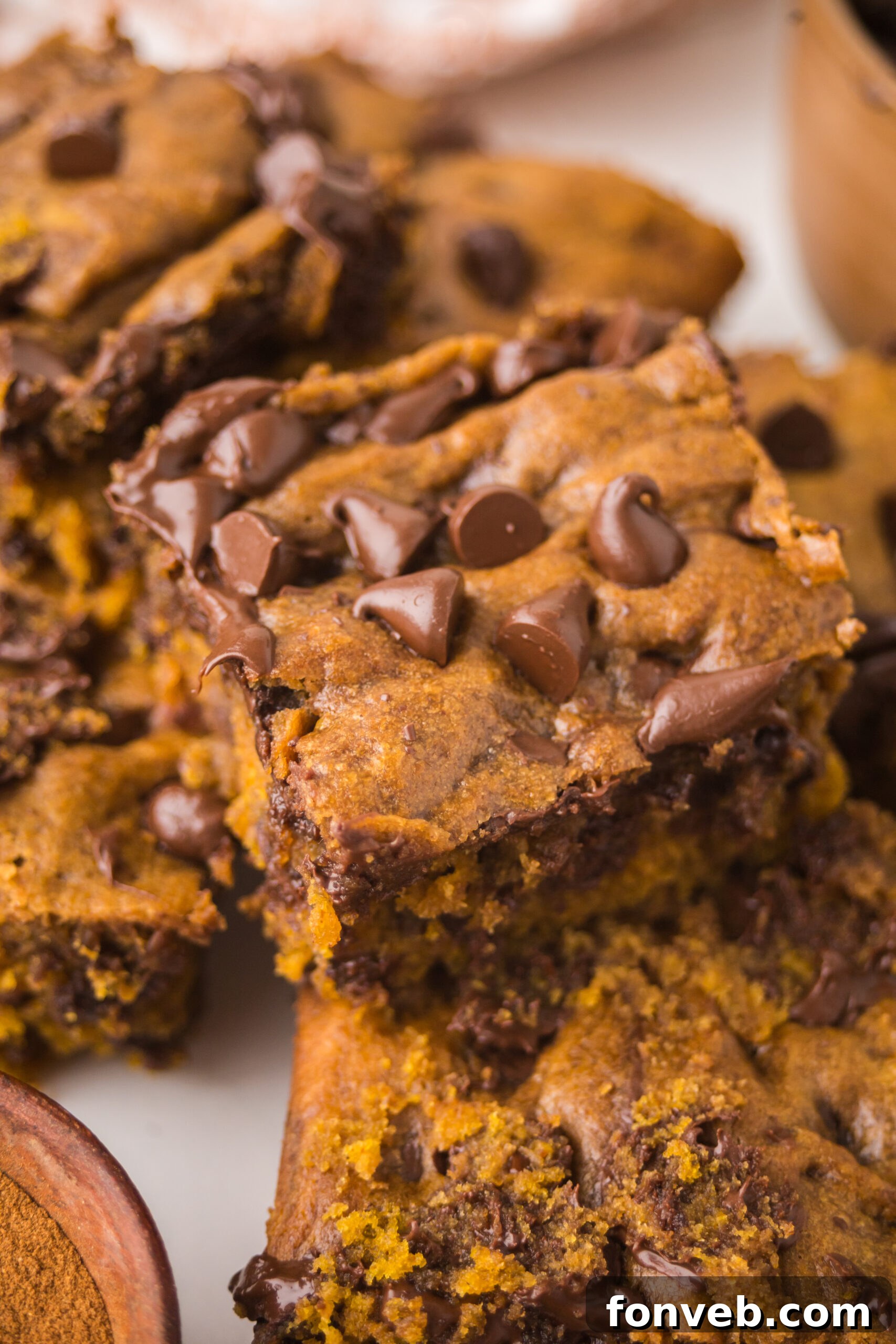 Brown Butter Pumpkin Chocolate Chip Bars stacked and sliced 