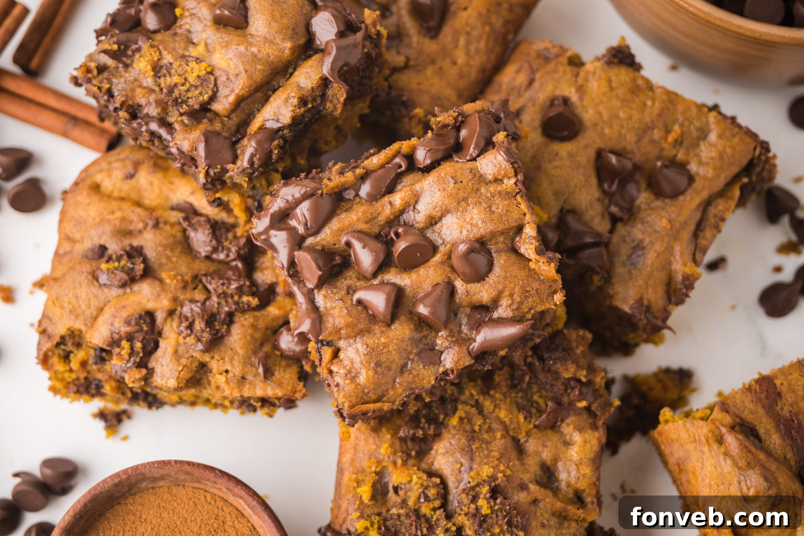 Overhead shot of the Brown Butter Pumpkin Chocolate Chip Bars stacked and sliced 