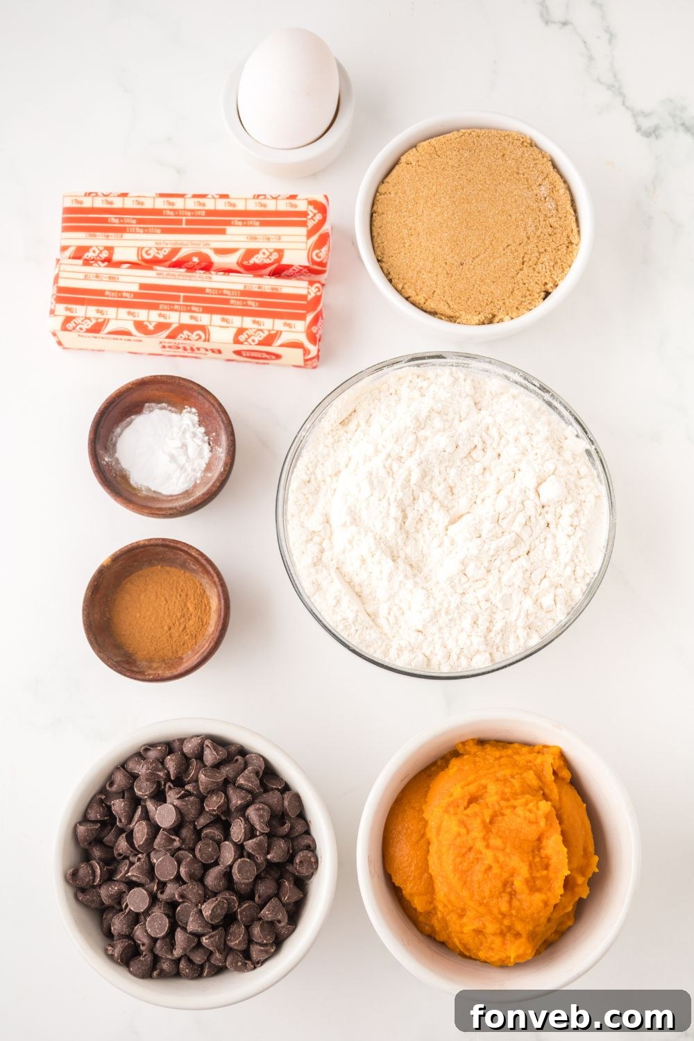 all the ingredients for Brown Butter Pumpkin Chocolate Chip Bars placed nicely on the table in single serve bowls 