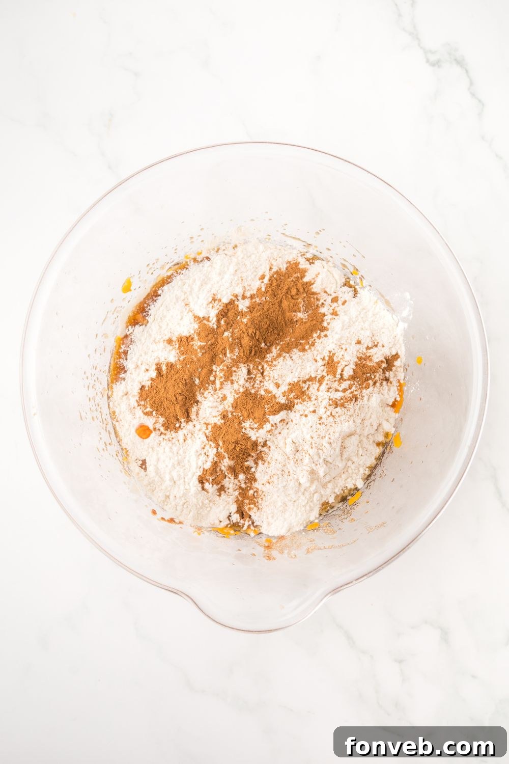 glass bowl with dry ingredients for making Brown Butter Pumpkin Chocolate Chip Bars