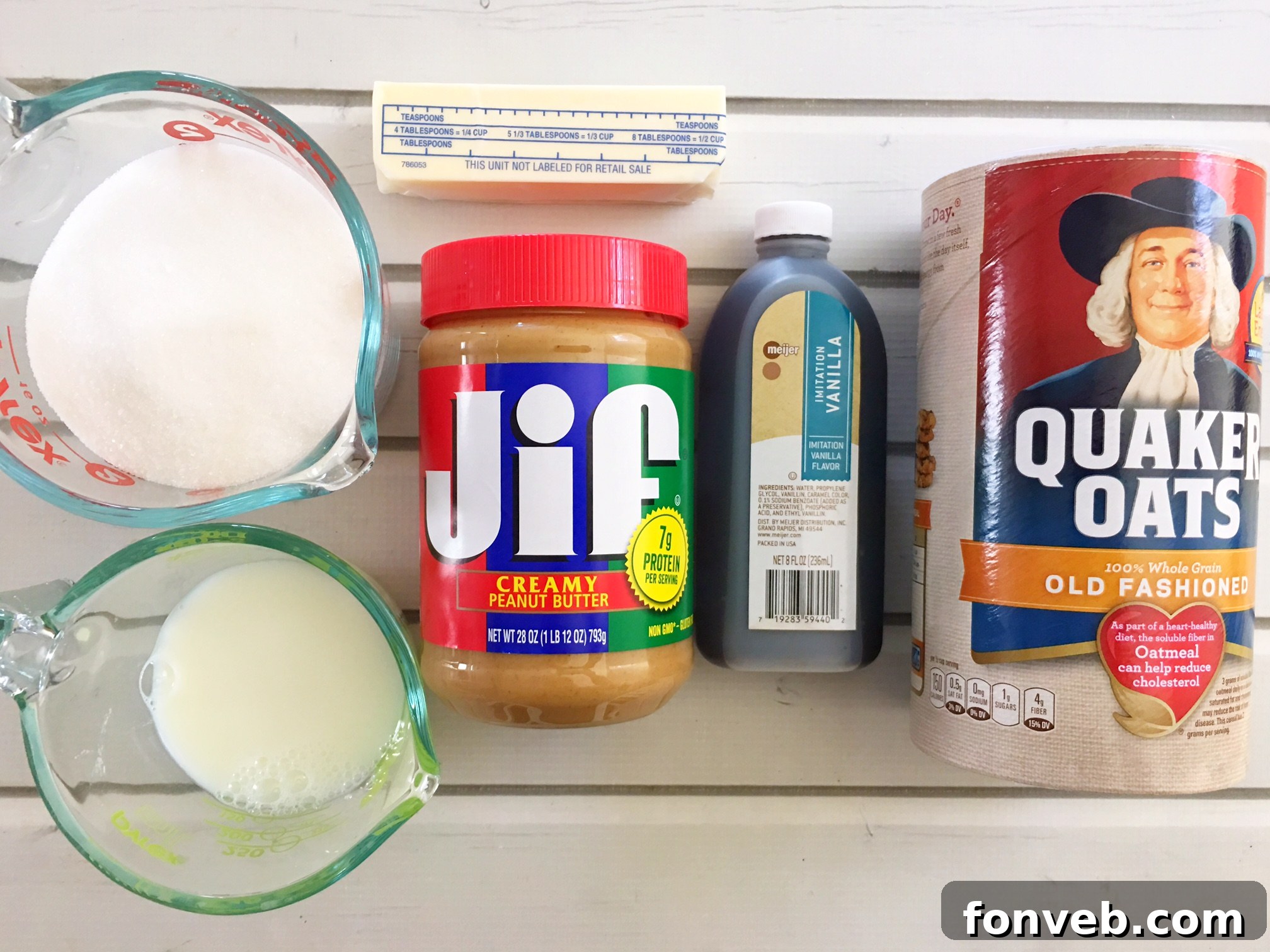 Close-up of a batch of freshly made no-bake cookies cooling on parchment paper, ready to be enjoyed.