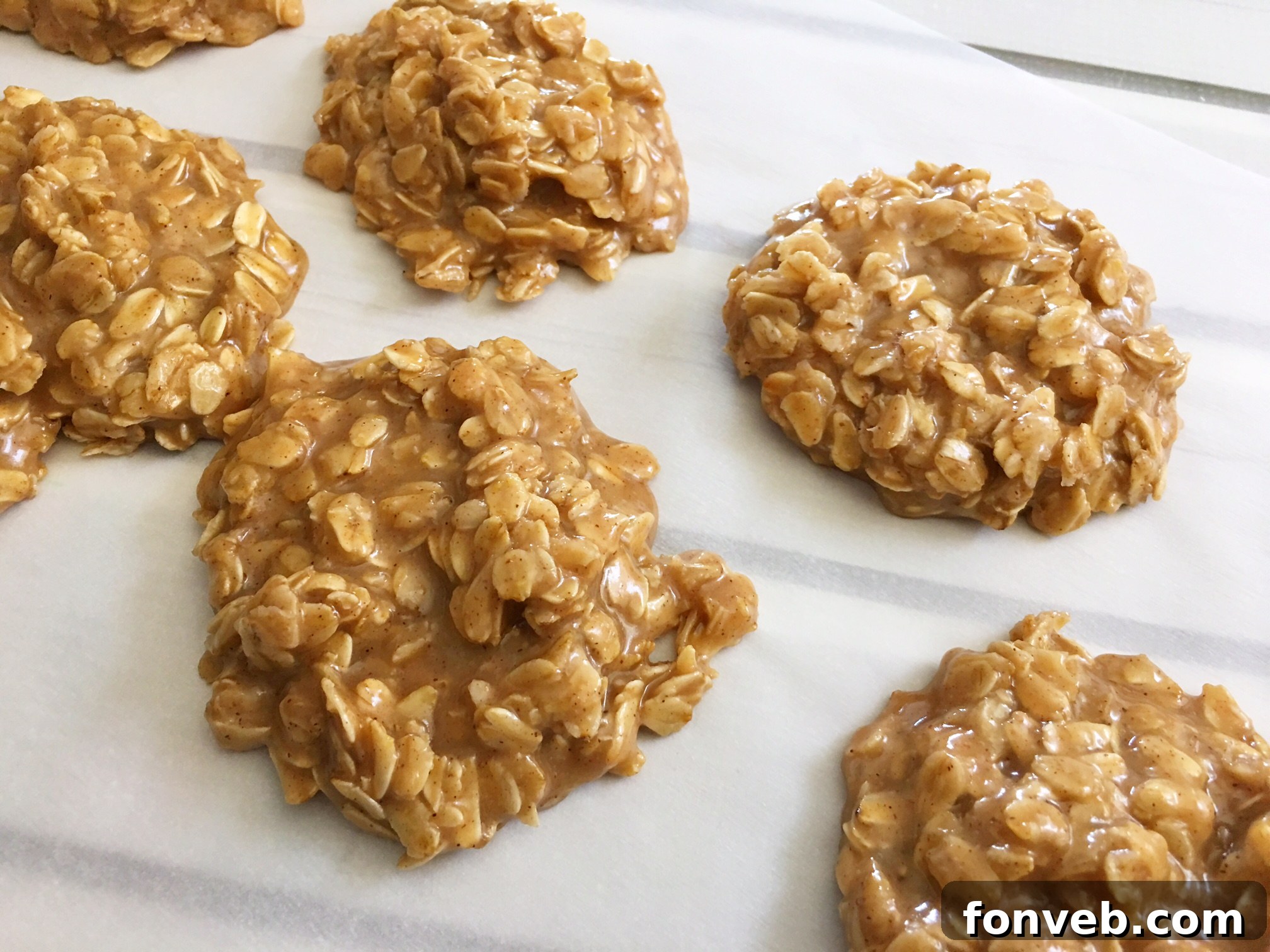 A stack of several peanut butter no-bake cookies, demonstrating their appealing texture and simple presentation.