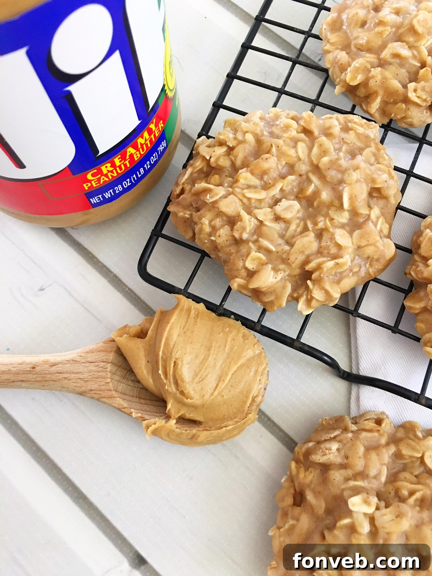 A larger batch of no-bake cookies spread out on a tray, cooling and hardening, indicating a successful recipe.