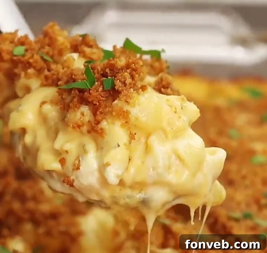 Rich and creamy baked macaroni and cheese in a casserole dish, ready to be served
