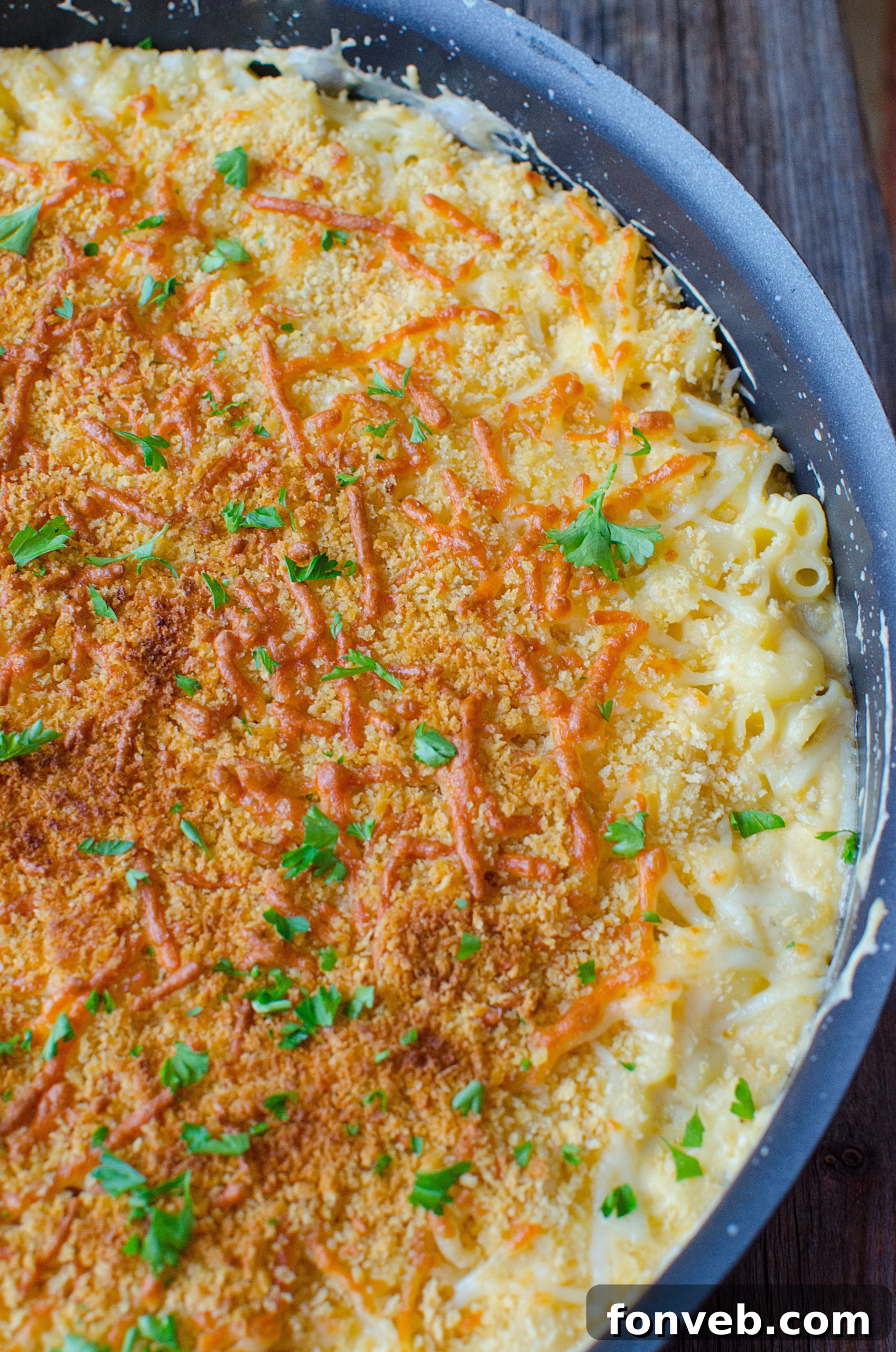 Ingredients for mac and cheese laid out, including various cheeses and spices