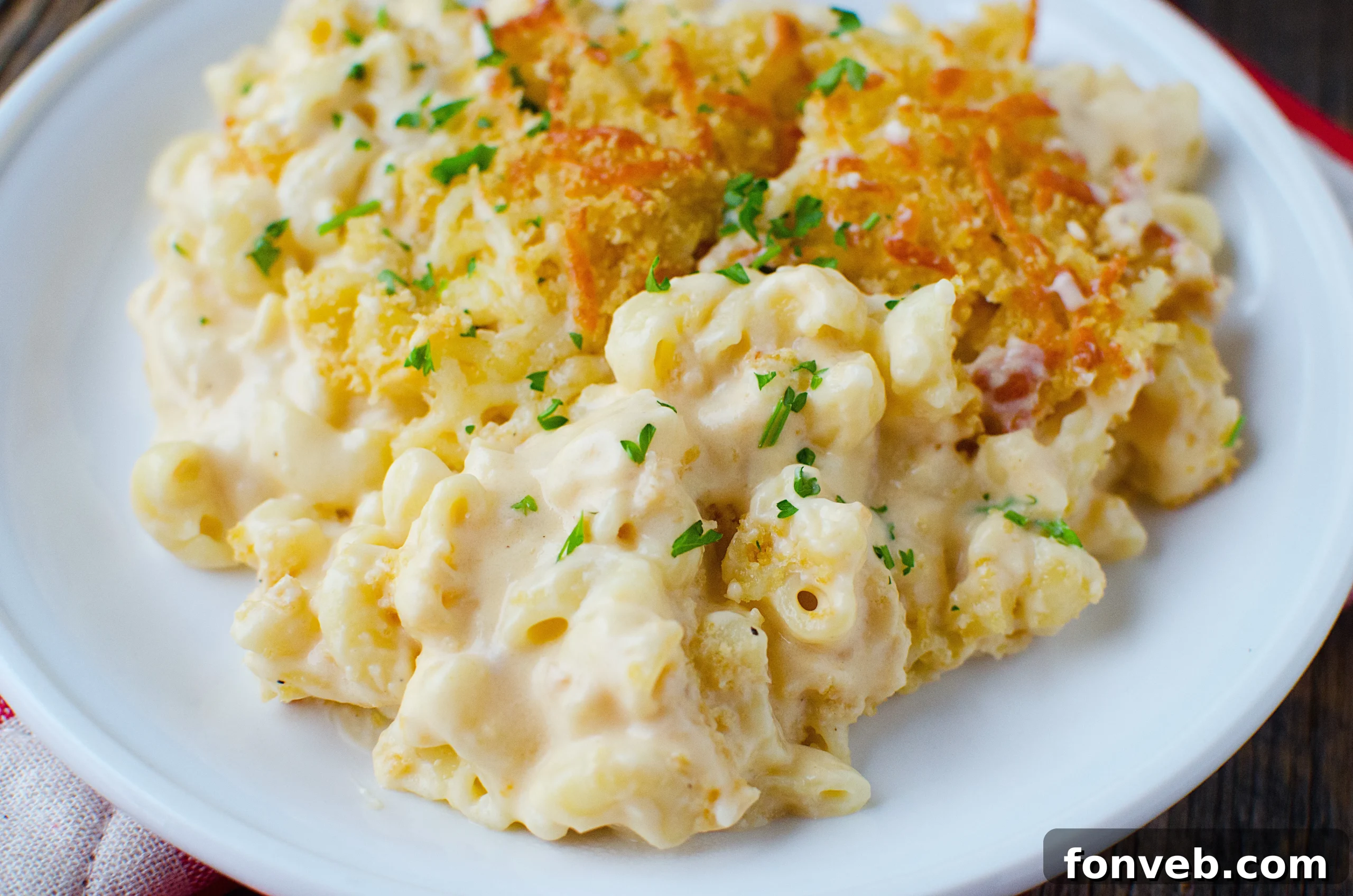 Close-up shot of the gooey, melted cheese sauce covering macaroni pasta