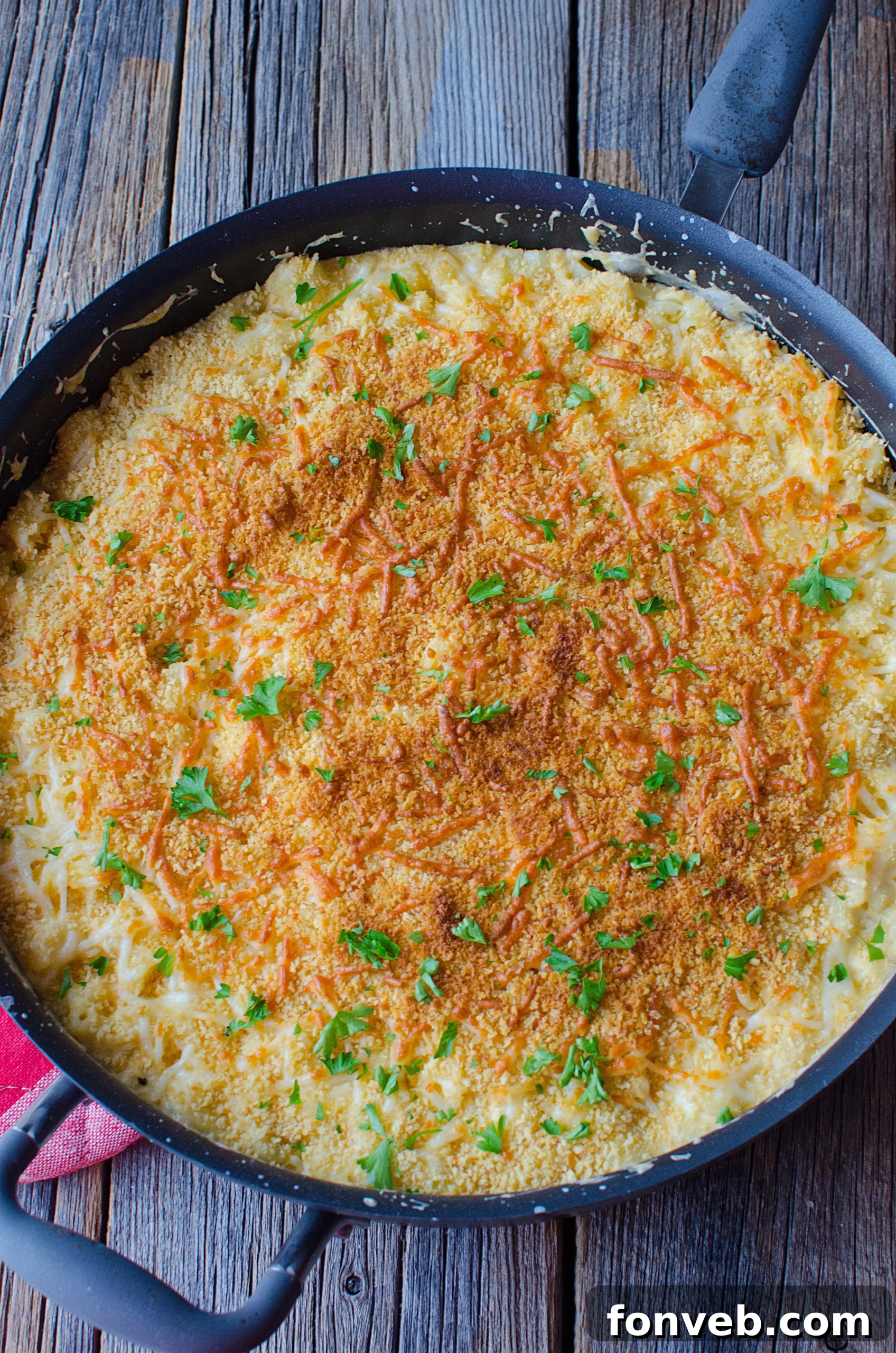 Close-up of the crunchy, golden panko breadcrumb topping on the baked mac and cheese