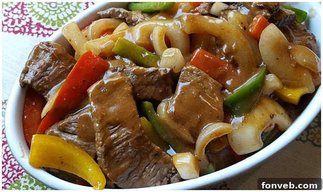 Pepper Steak with rice on a plate