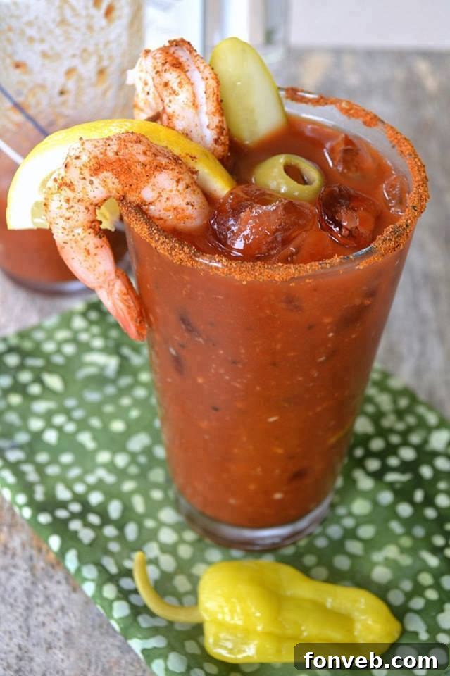 Spicy Bloody Mary cocktail garnished with celery and olives