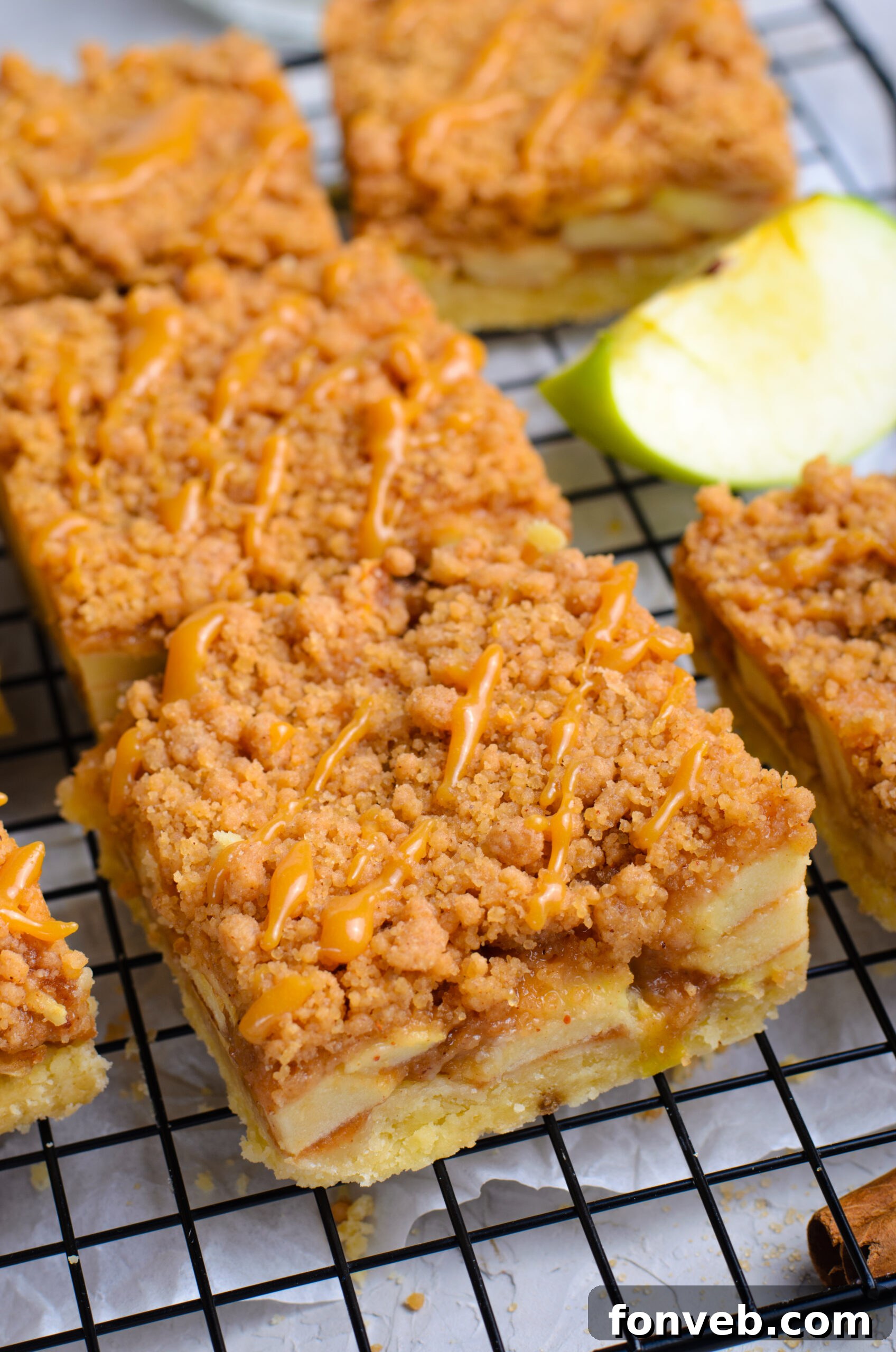 Up close angle of the Caramel Apple Pie Bars on a wire cooling rack