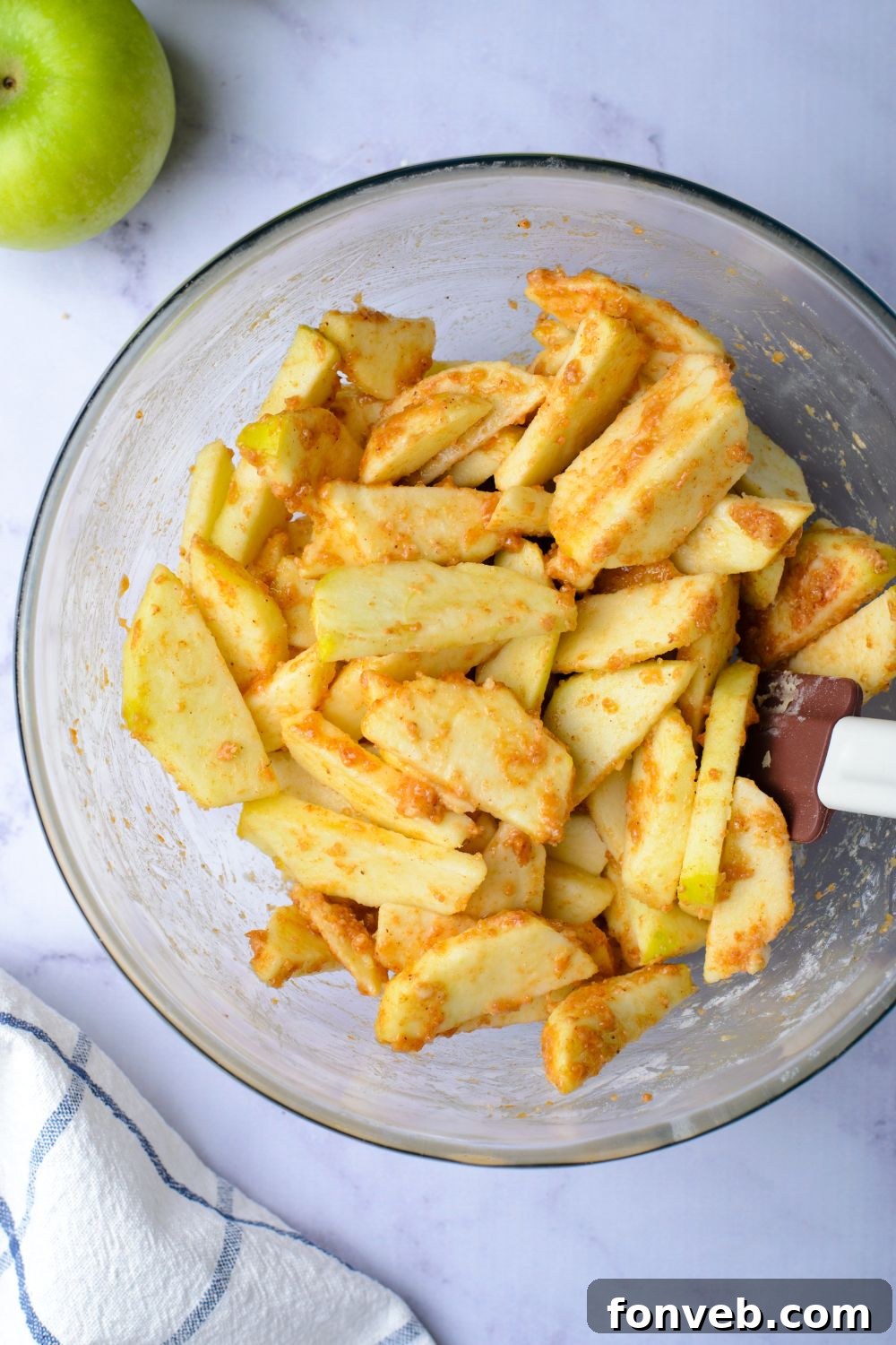 sliced apples tossed in a cinnamon mixture