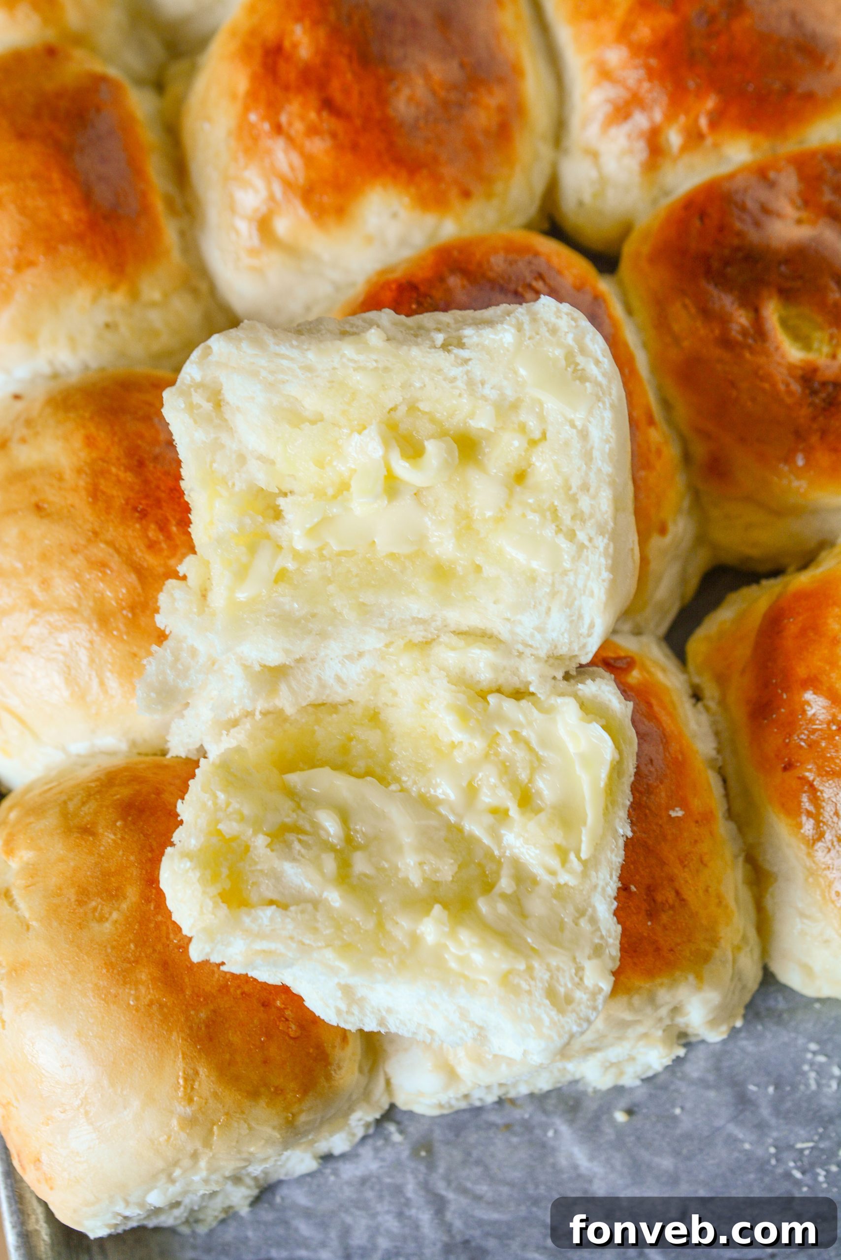 A beautifully composed shot of freshly baked dinner rolls, ready to be served.