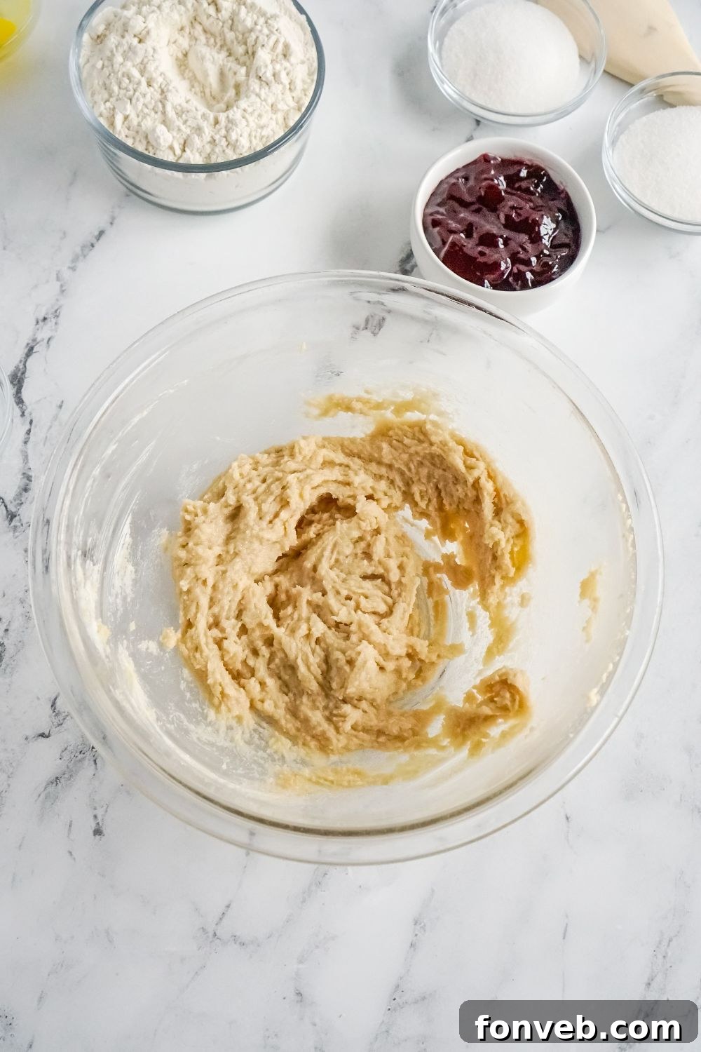 Raspberry Thumbprint Cookie dough in a glass bowl on table
