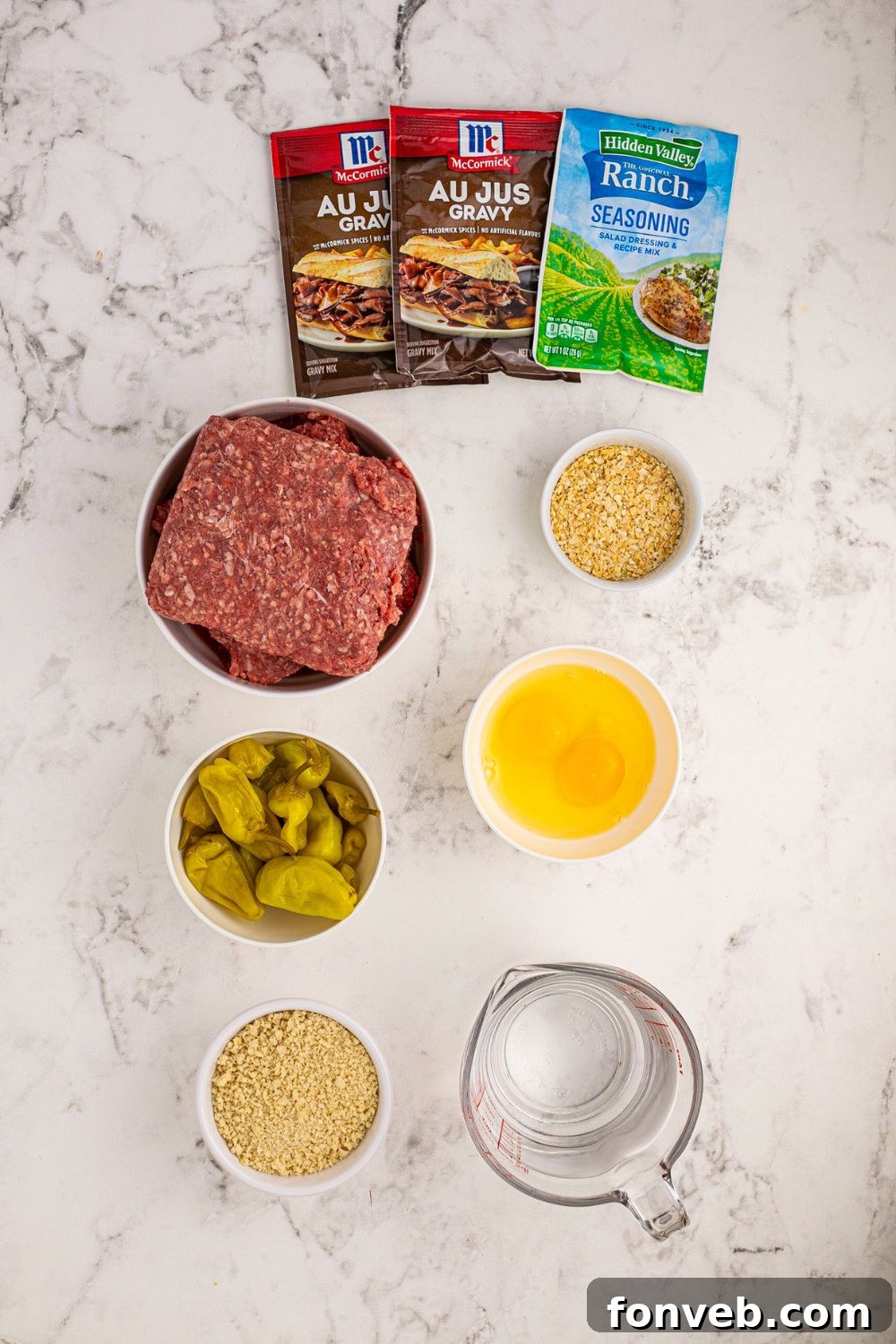 all the ingredients for Crockpot Mississippi Meatloaf in single serve containers on a white table 