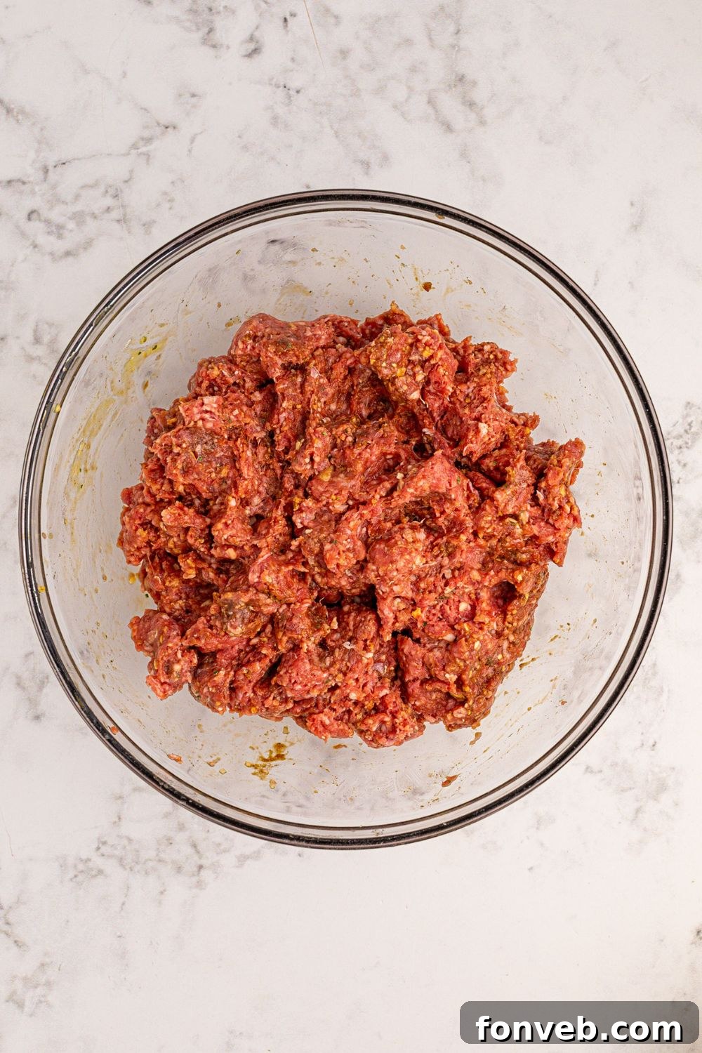 ground beef in a glass bowl on the table 