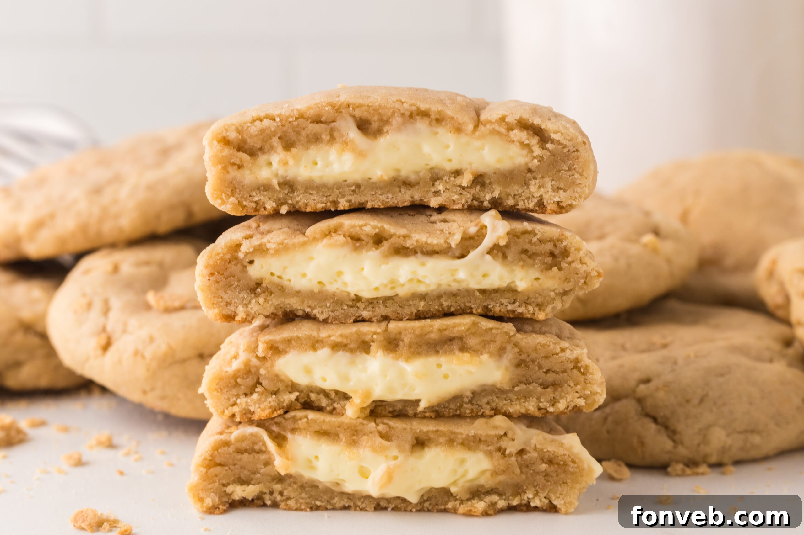 New York cheesecake stuffed cookies stacked on top of one another