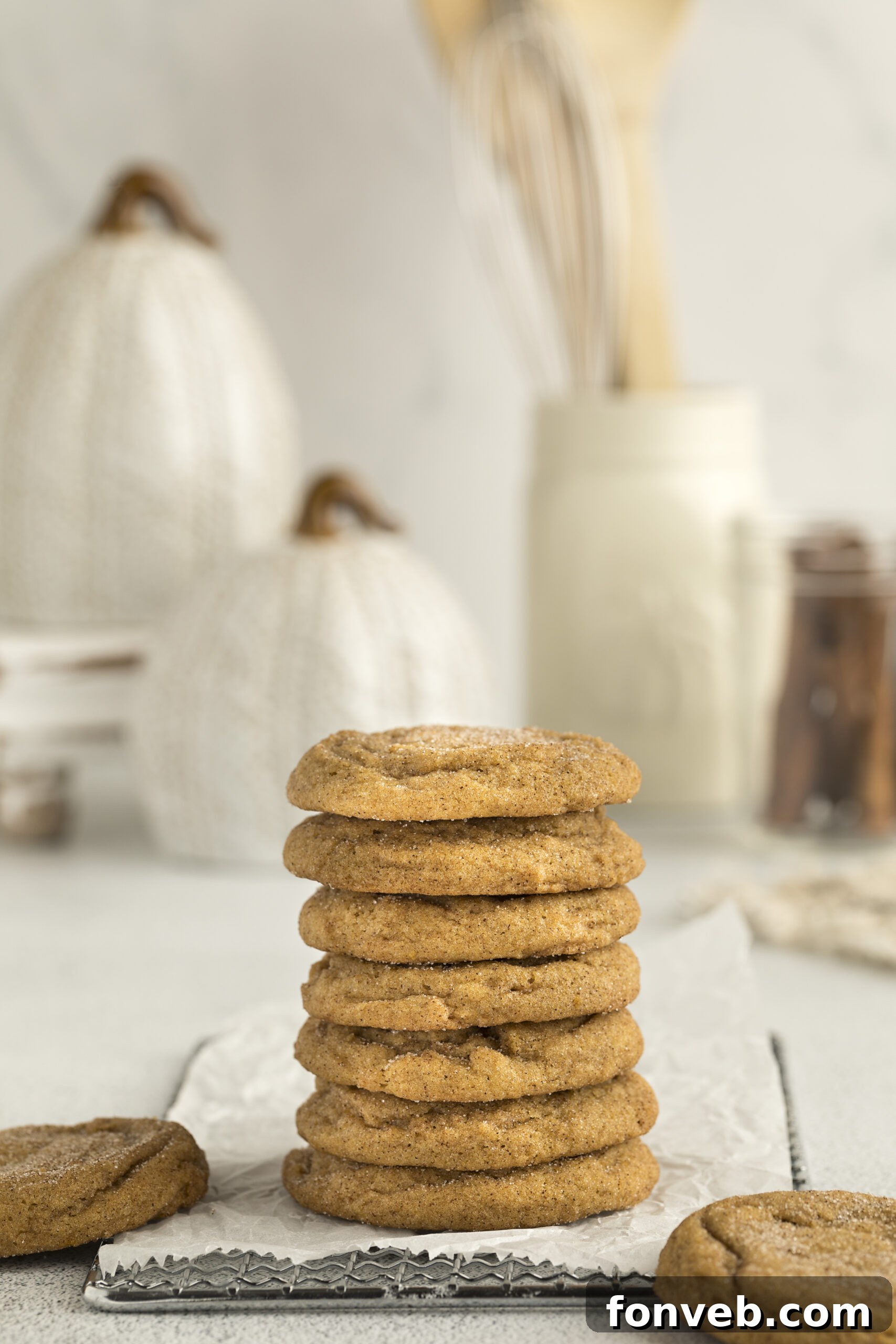 Spiced Pumpkin Snickerdoodle Cookies 3 Pumpkin Snickerdoodle Cookies stacked on a white table