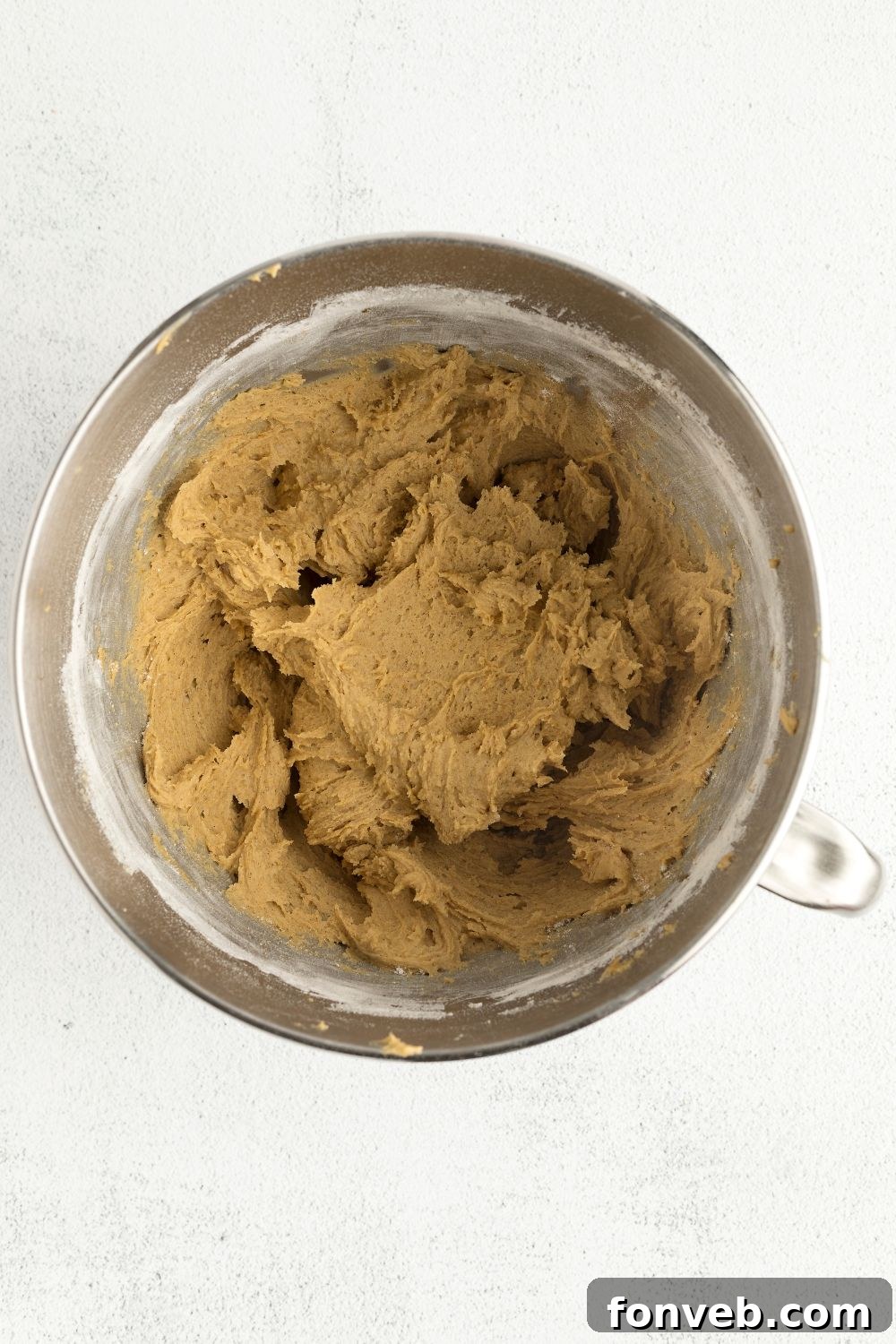 Spiced Pumpkin Snickerdoodle Cookies 7 pumpkin cookie batter in a metal bowl