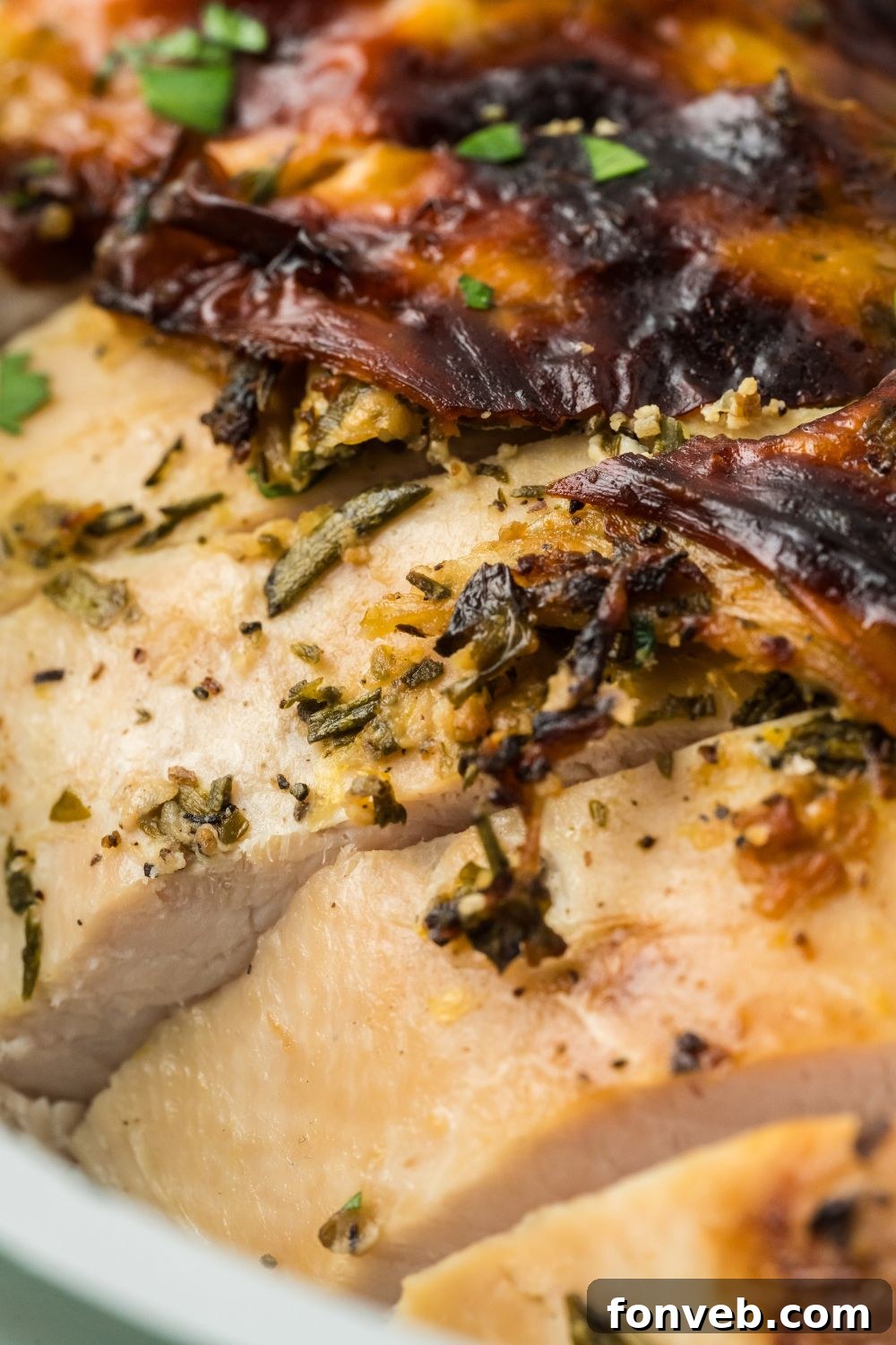 Close up of a seasoned and Roasted Turkey Breast that is sliced into pieces