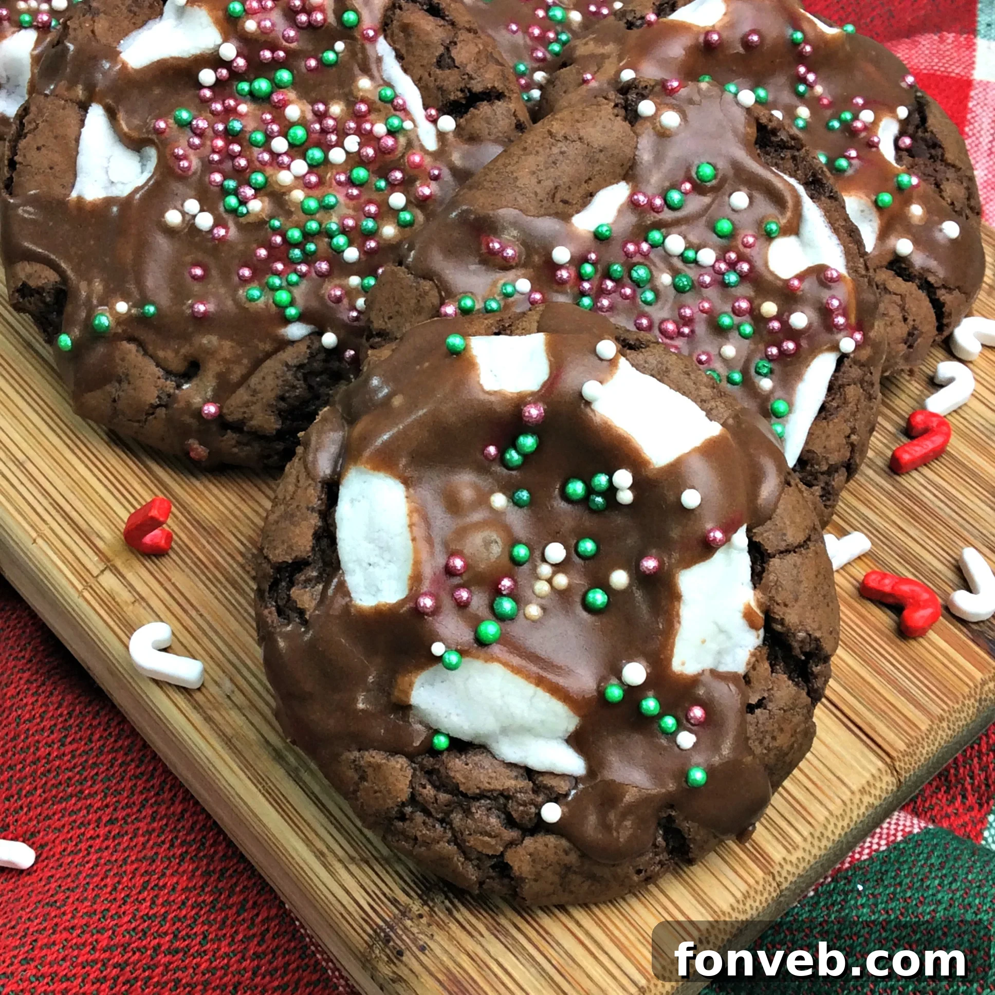 Delicious hot cocoa marshmallow cookies on a baking sheet, fresh out of the oven