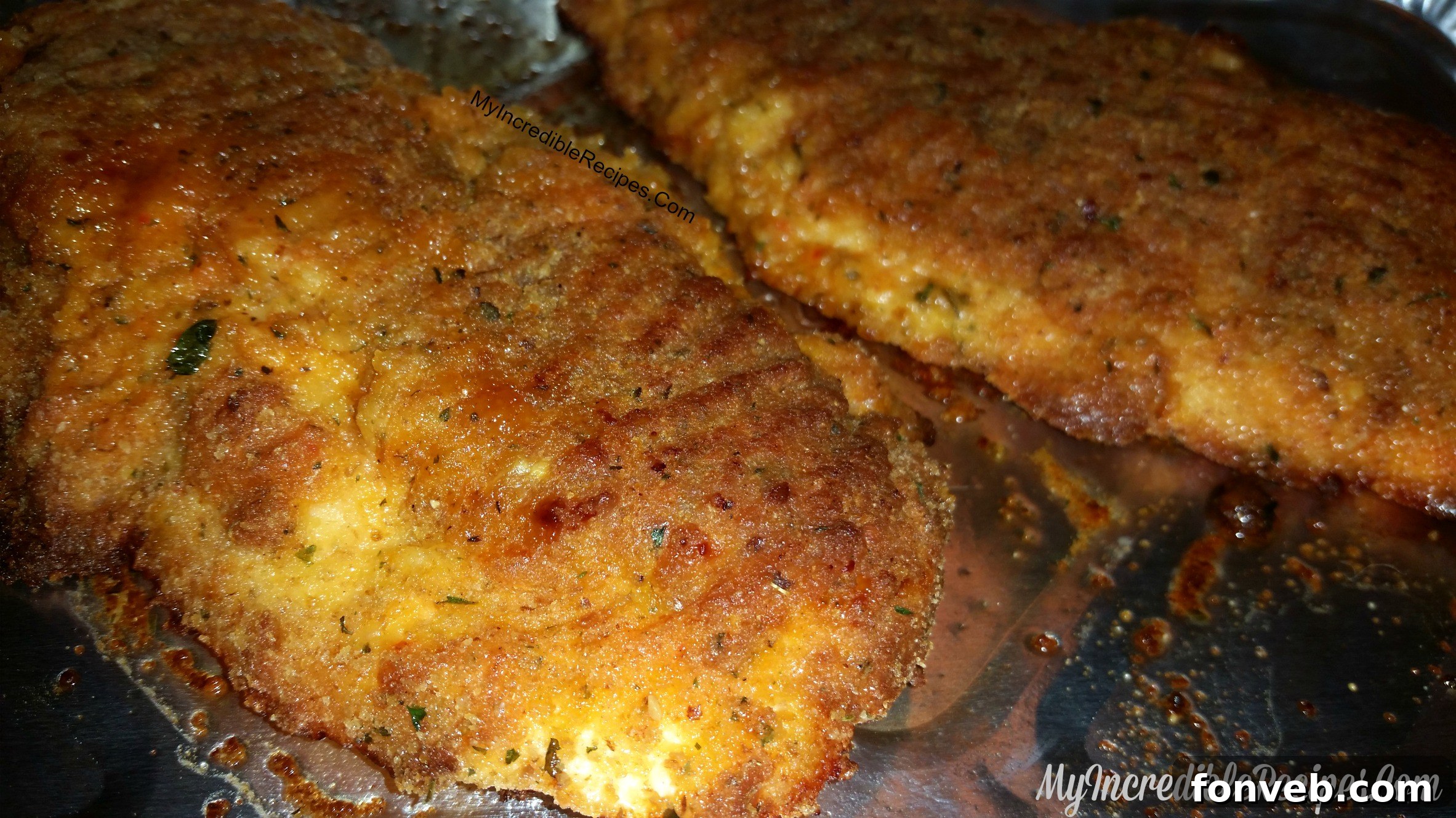 Ingredients for Parmesan oven-fried chicken, including fresh Parmesan