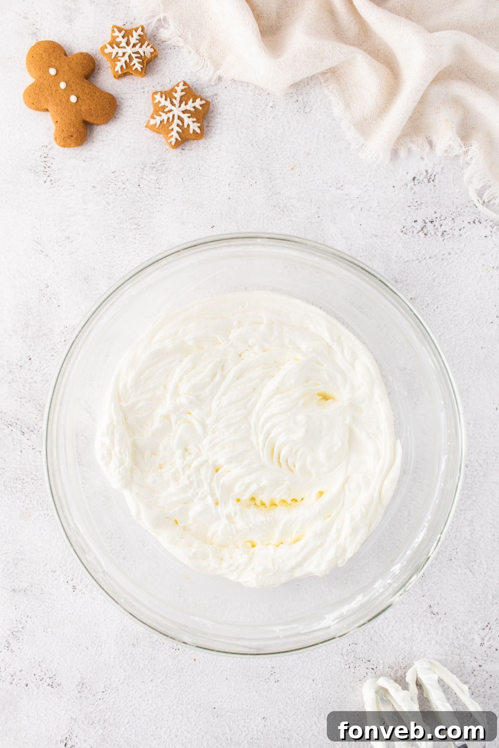 cheesecake batter in a glass bowl on table