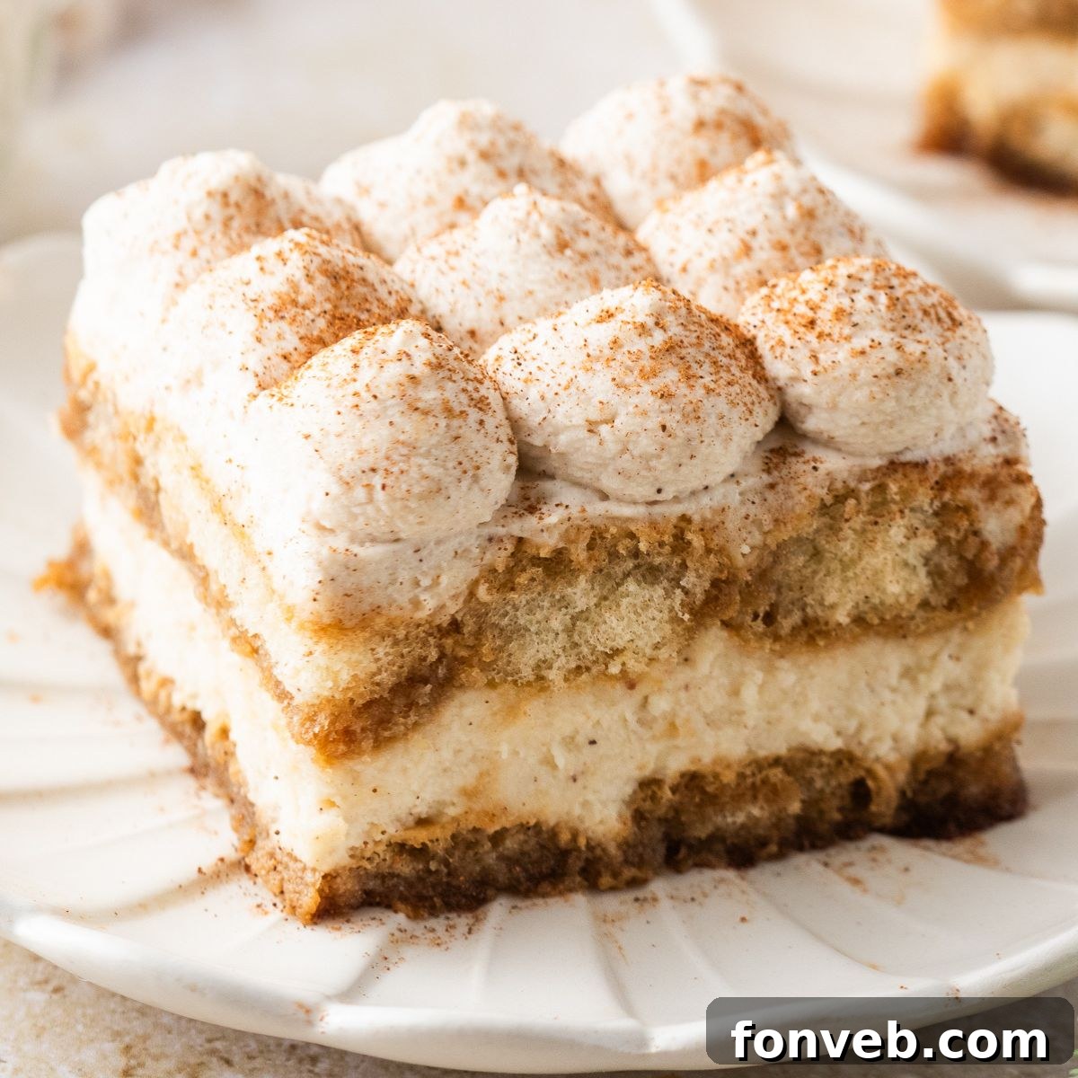 slice of Eggnog Tiramisu on a white plate on table 