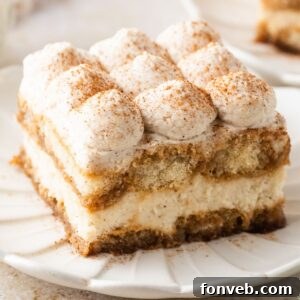 slice of Eggnog Tiramisu on a white plate on table