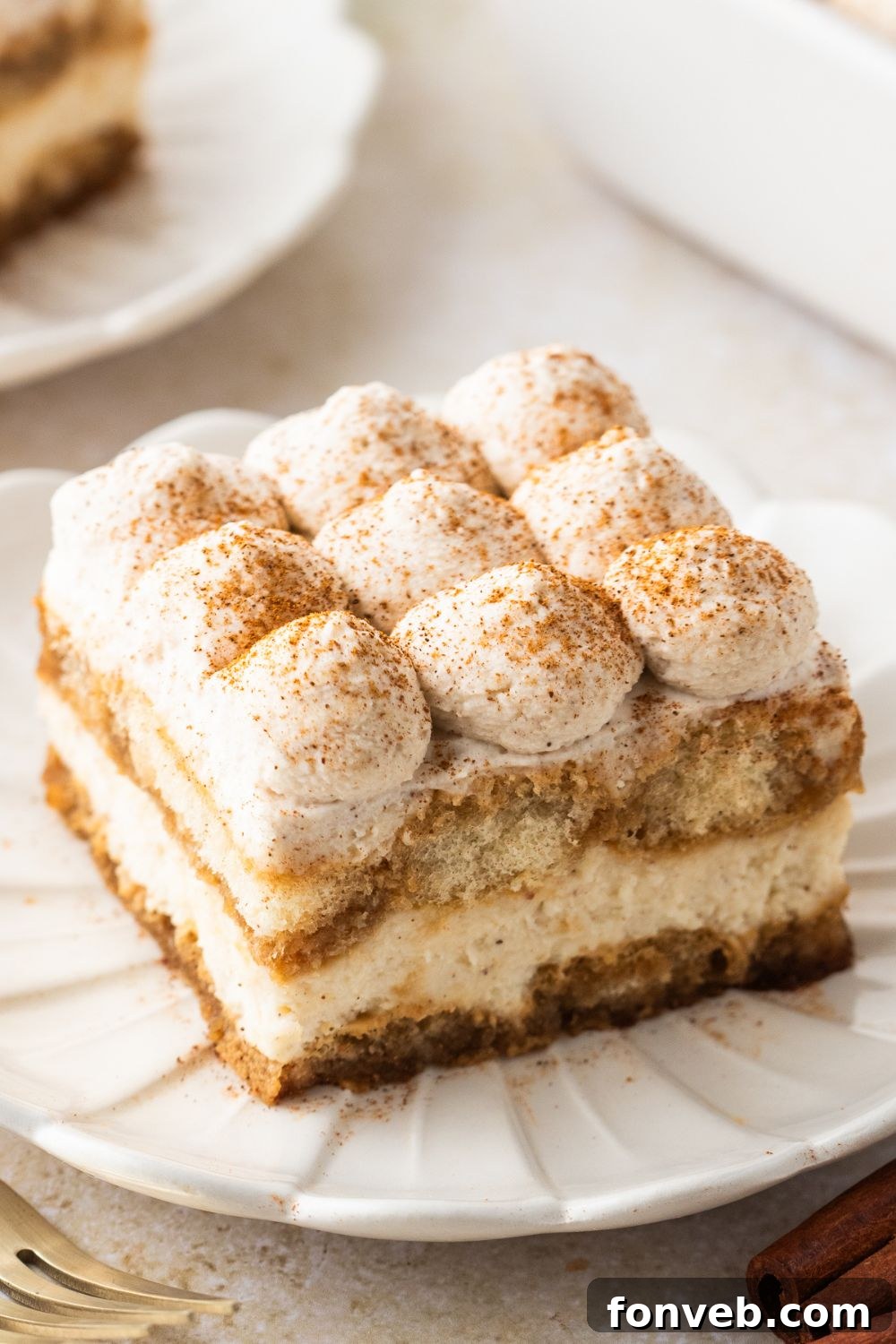 looking at the table with plates with slices of Eggnog Tiramisu 