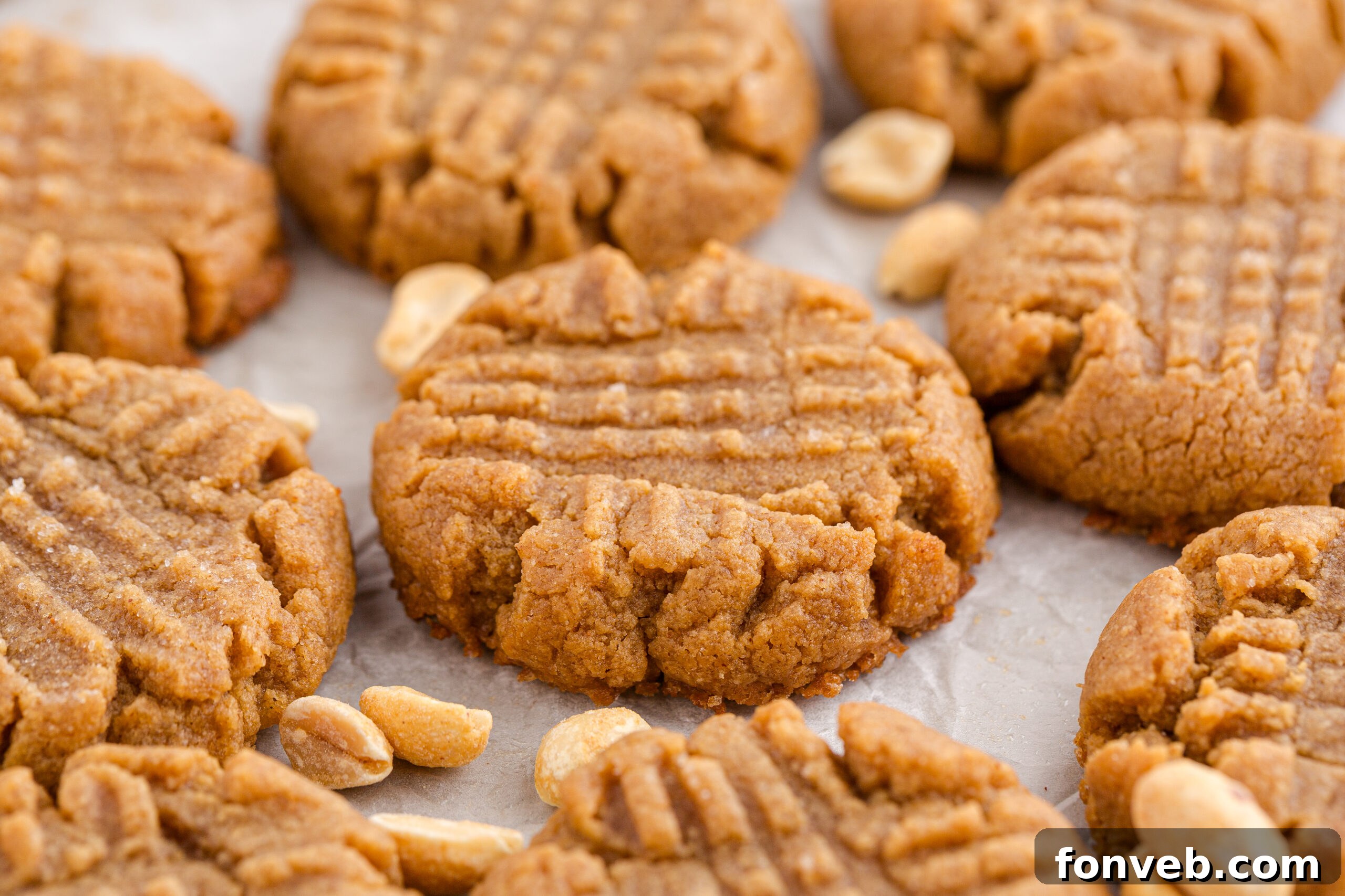 Easy 4-Ingredient Flourless Peanut Butter Cookies 23 4 Ingredient Peanut Butter Cookies spread out on a table