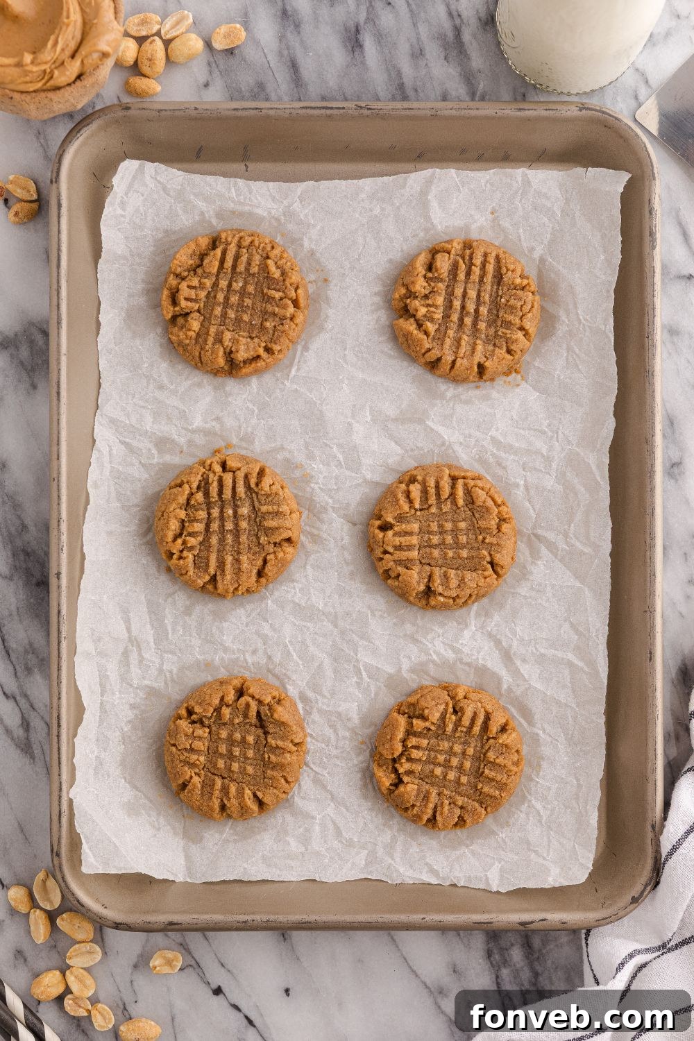 Easy 4-Ingredient Flourless Peanut Butter Cookies 9 sheet pan with baked 4 Ingredient Peanut Butter Cookies on a cookie tray