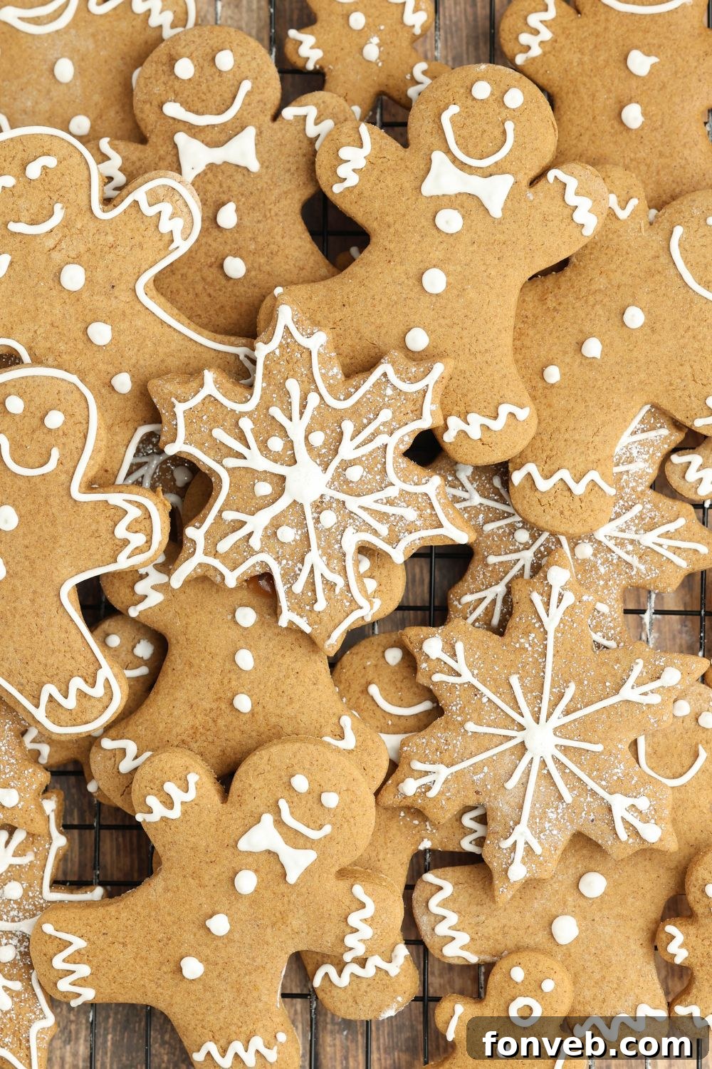 Dazzling Christmas Gingerbread Adorned With Royal Icing 19 Christmas gingerbread cookies scattered all over the table