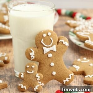 Dazzling Christmas Gingerbread Adorned With Royal Icing 23 Christmas Gingerbread Cookies (No-Spread Cut-Outs – Gluten-Free Option!) learned up against a glass of milk on table