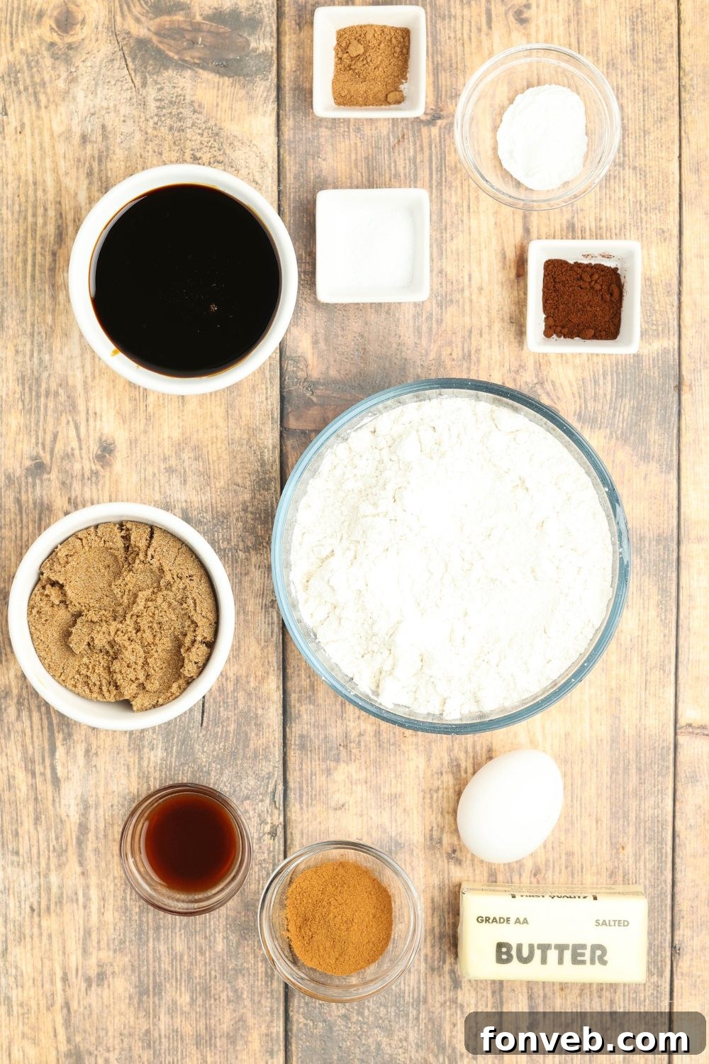 Dazzling Christmas Gingerbread Adorned With Royal Icing 4 all the ingredients for Christmas gingerbread cookies on a wooden table in single serve bowls