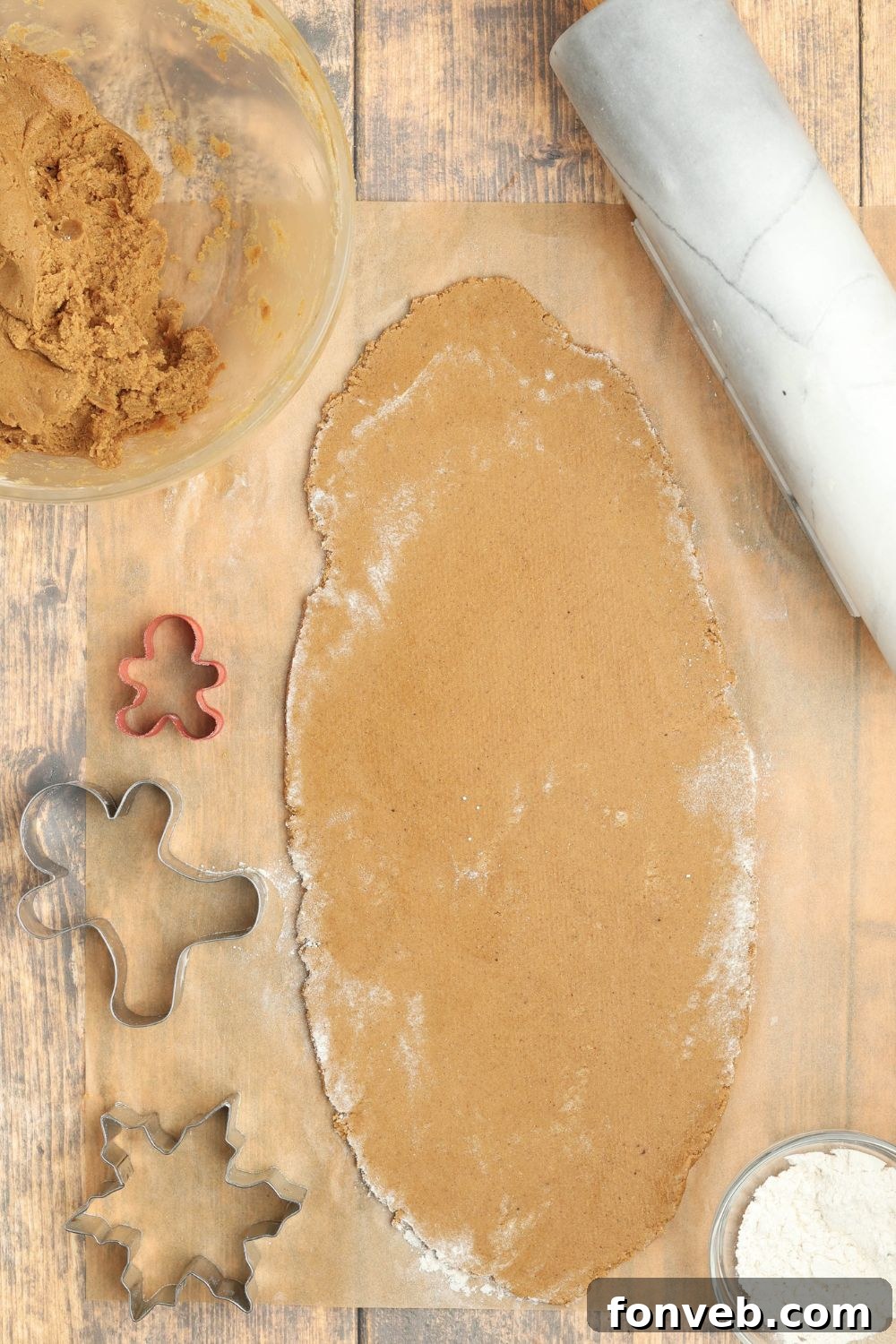 Dazzling Christmas Gingerbread Adorned With Royal Icing 6 rolled out cookie dough on table