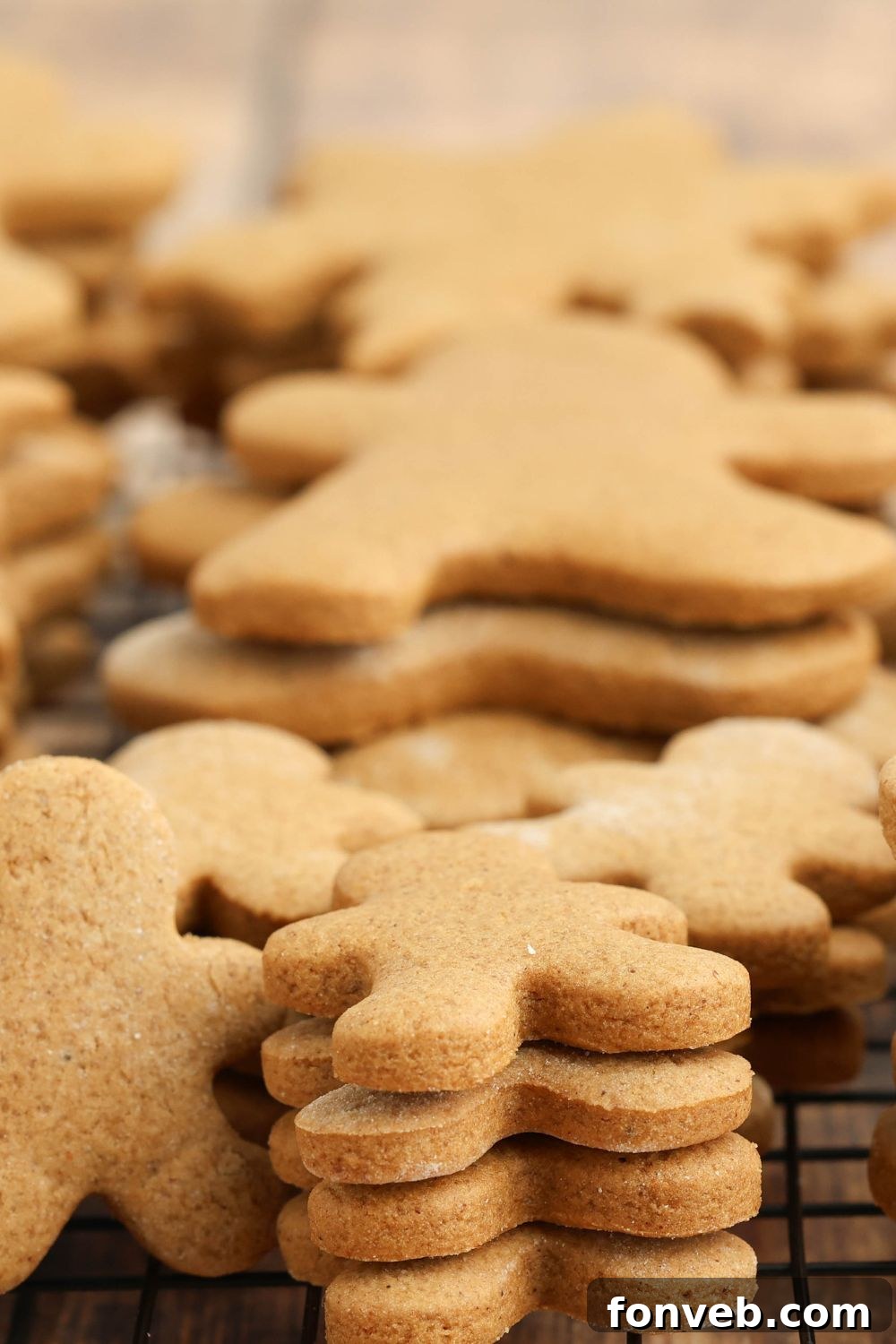 Dazzling Christmas Gingerbread Adorned With Royal Icing 9 stack of unfrosted gingerbread cookies on the table